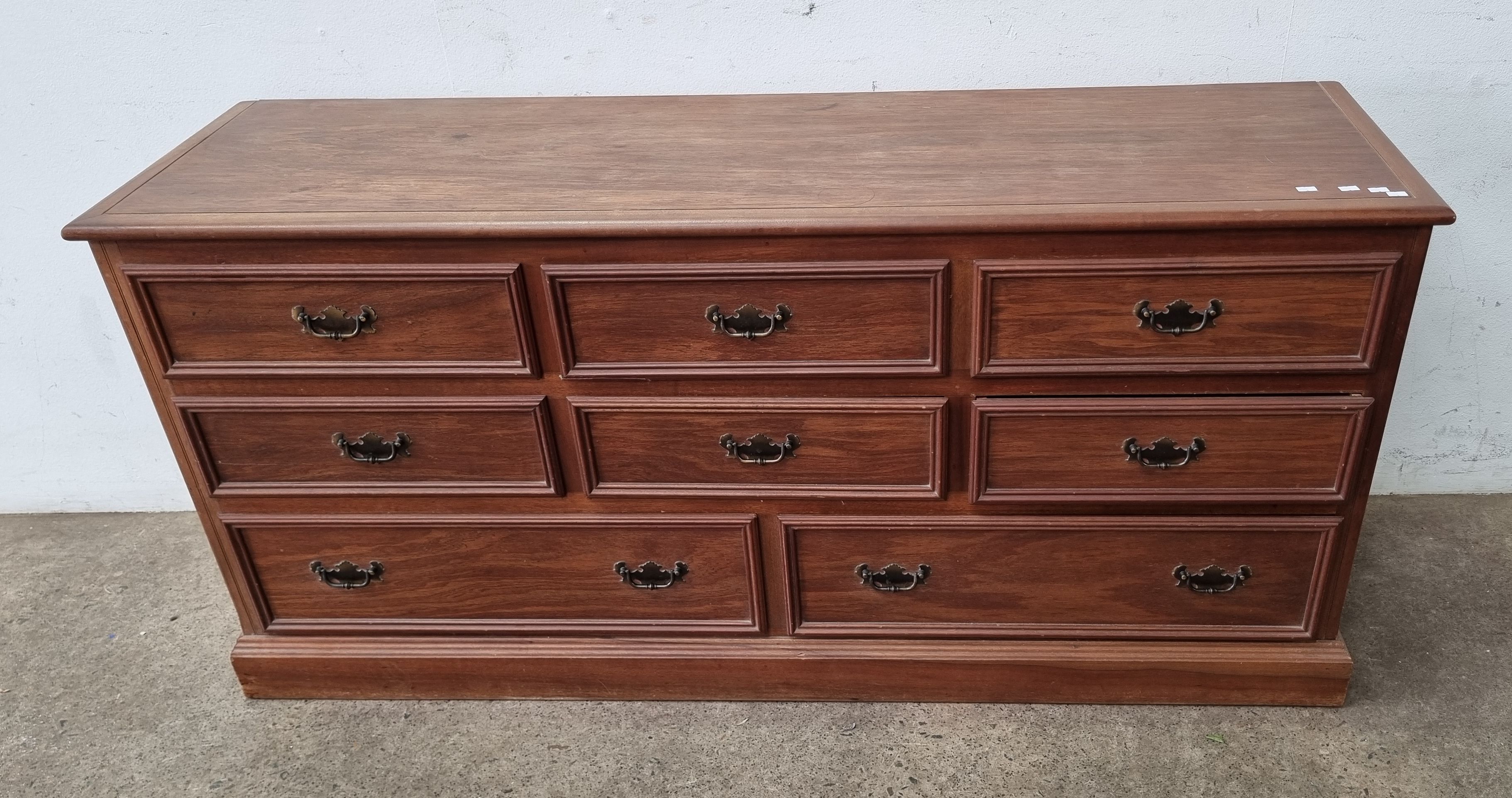 A Timber Chest Of Drawers