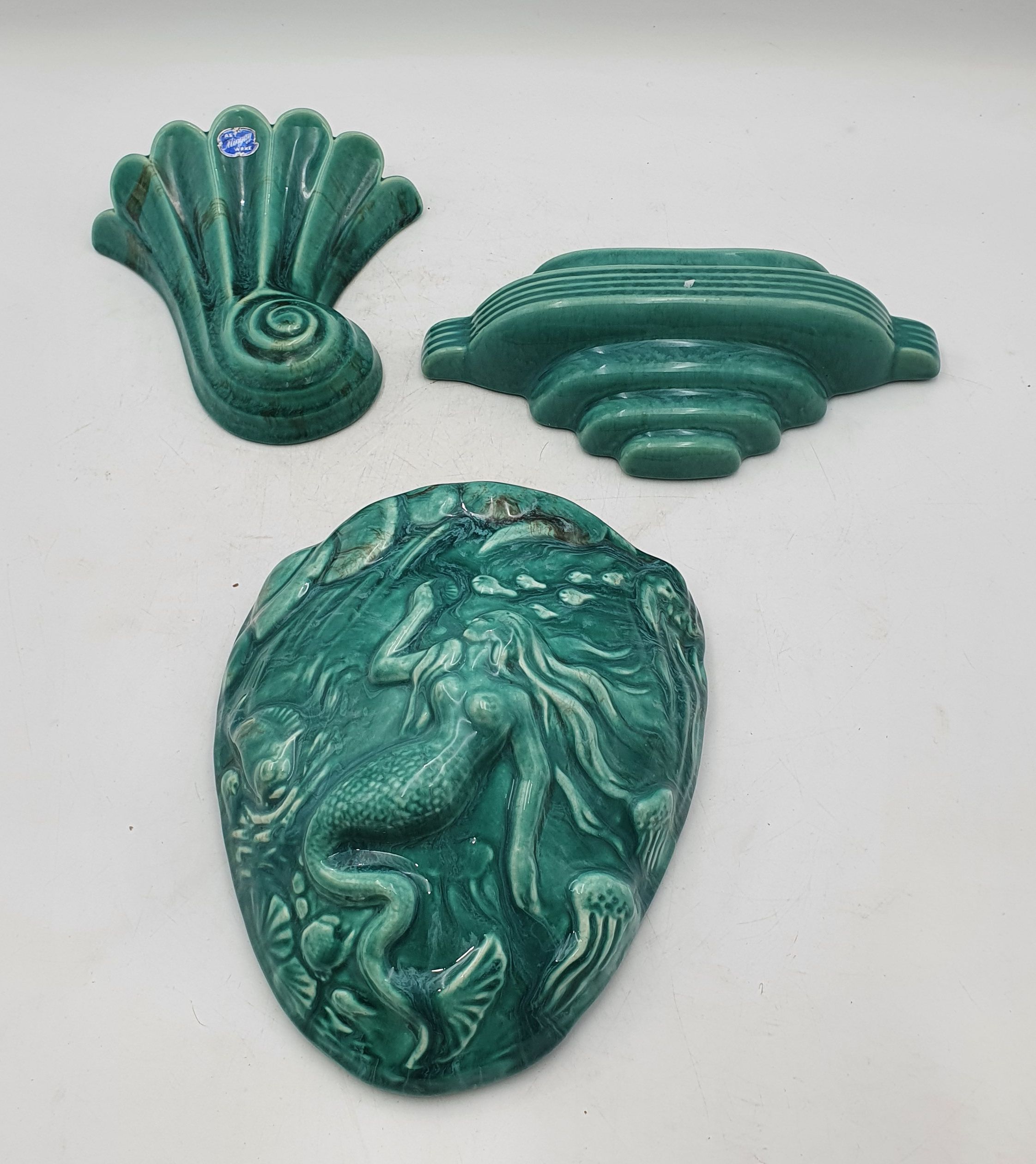 671 · THREE MCP POTTERY TEAL WALL VASES