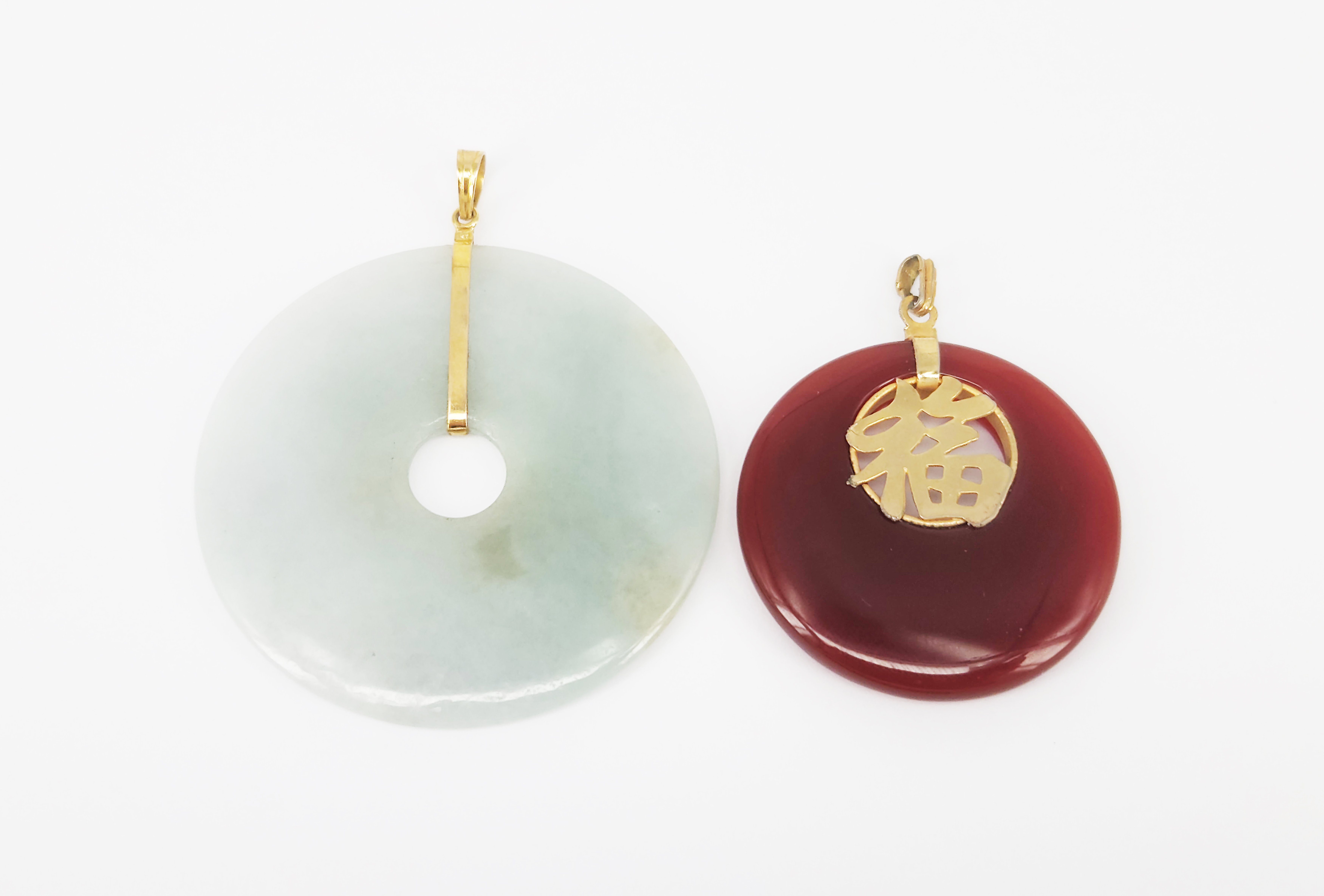 A Large Round Jade Disc Pendant Together With A Chinese Red Agate Deix Pendant