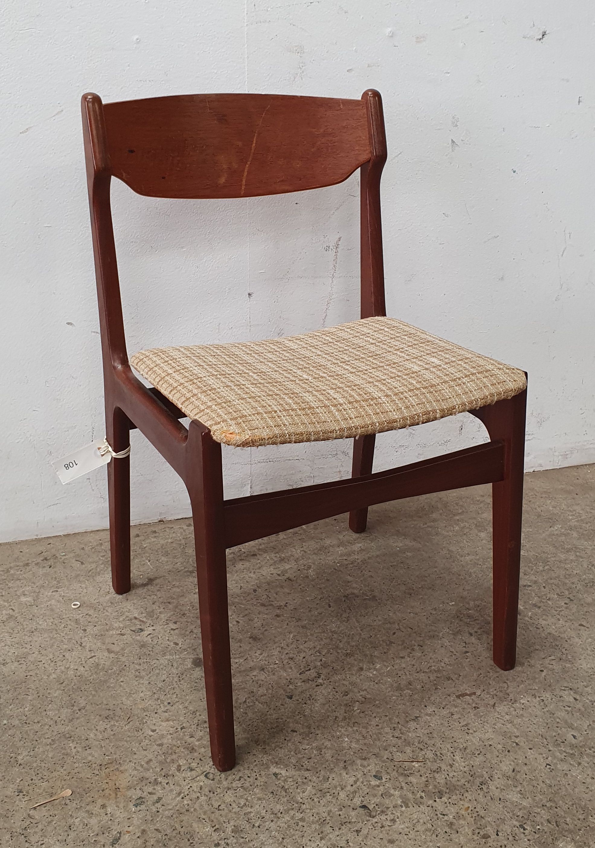 A mid century upholstered fabric chair