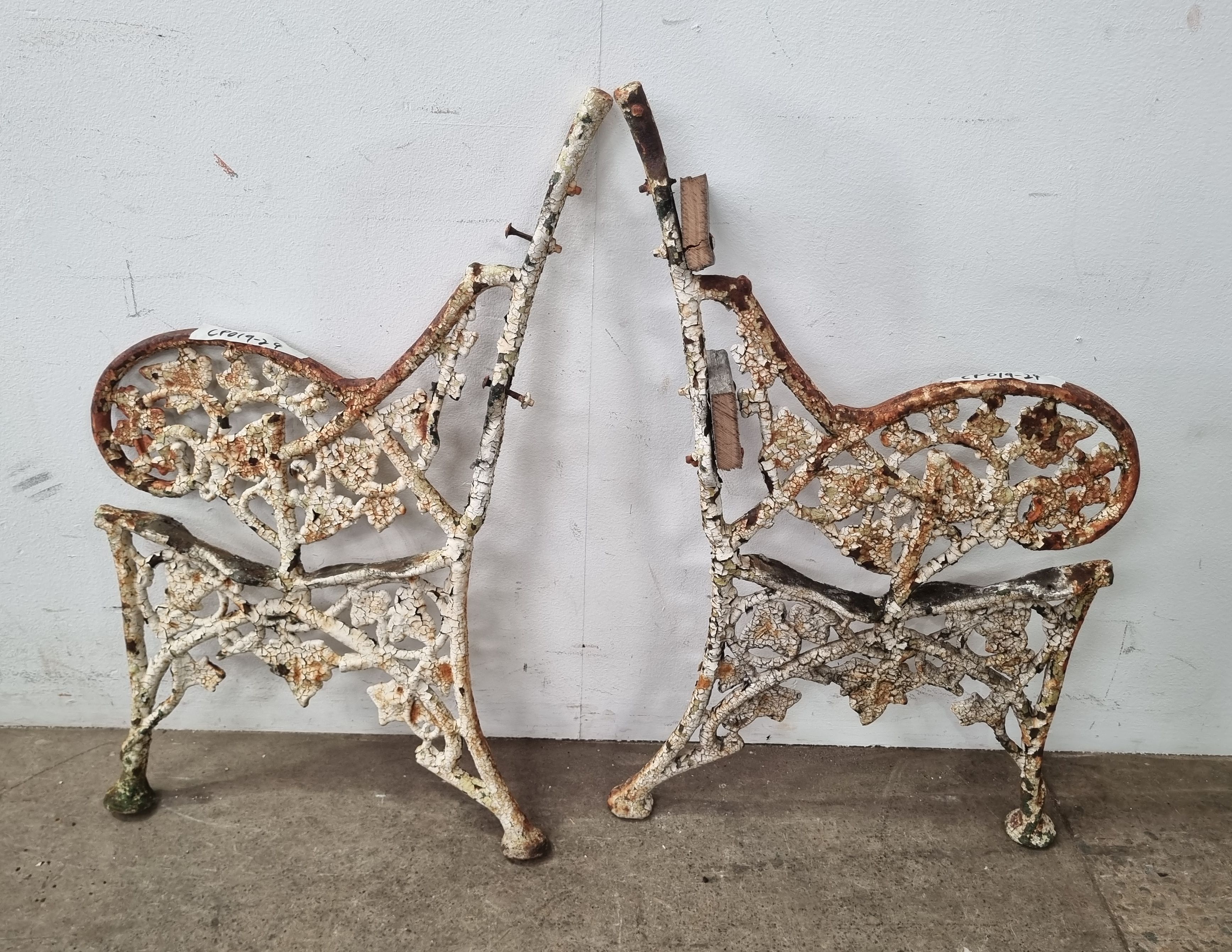 1195 · A PAIR OF CAST IRON BENCH ENDS