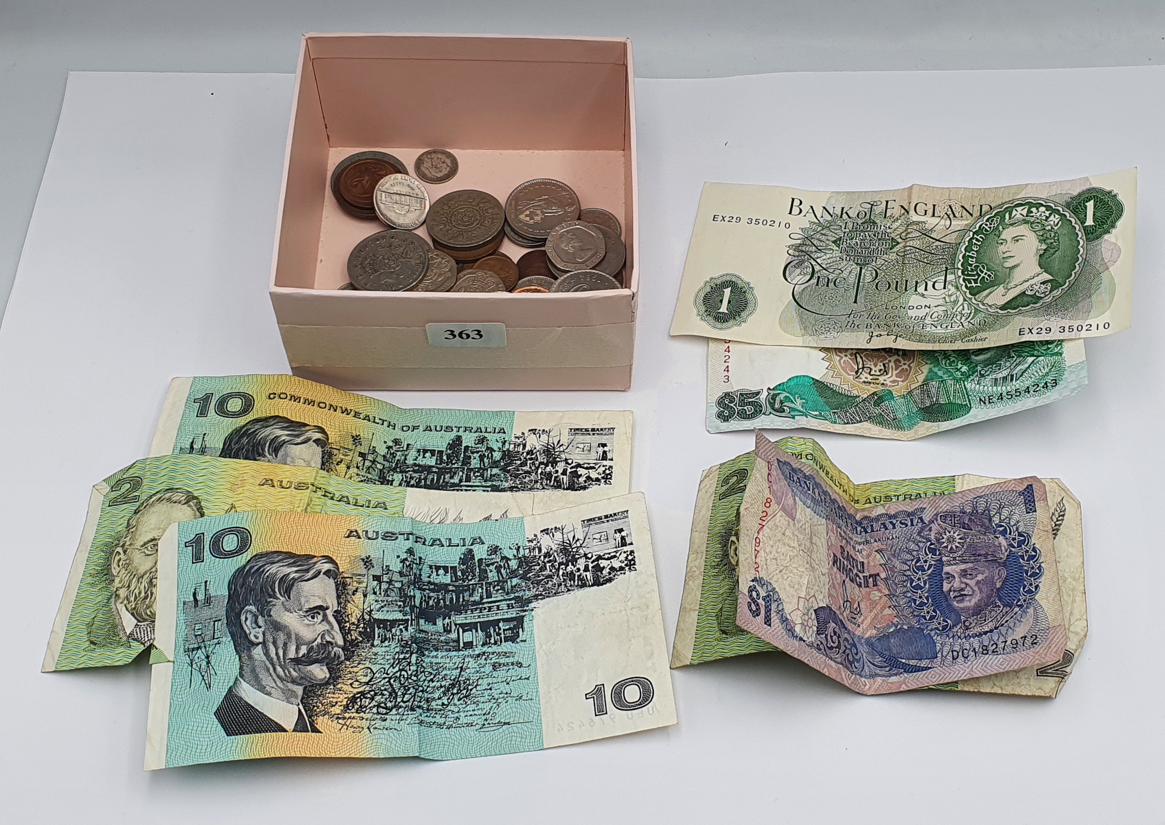 A QUANITY OF COINS AND NOTES