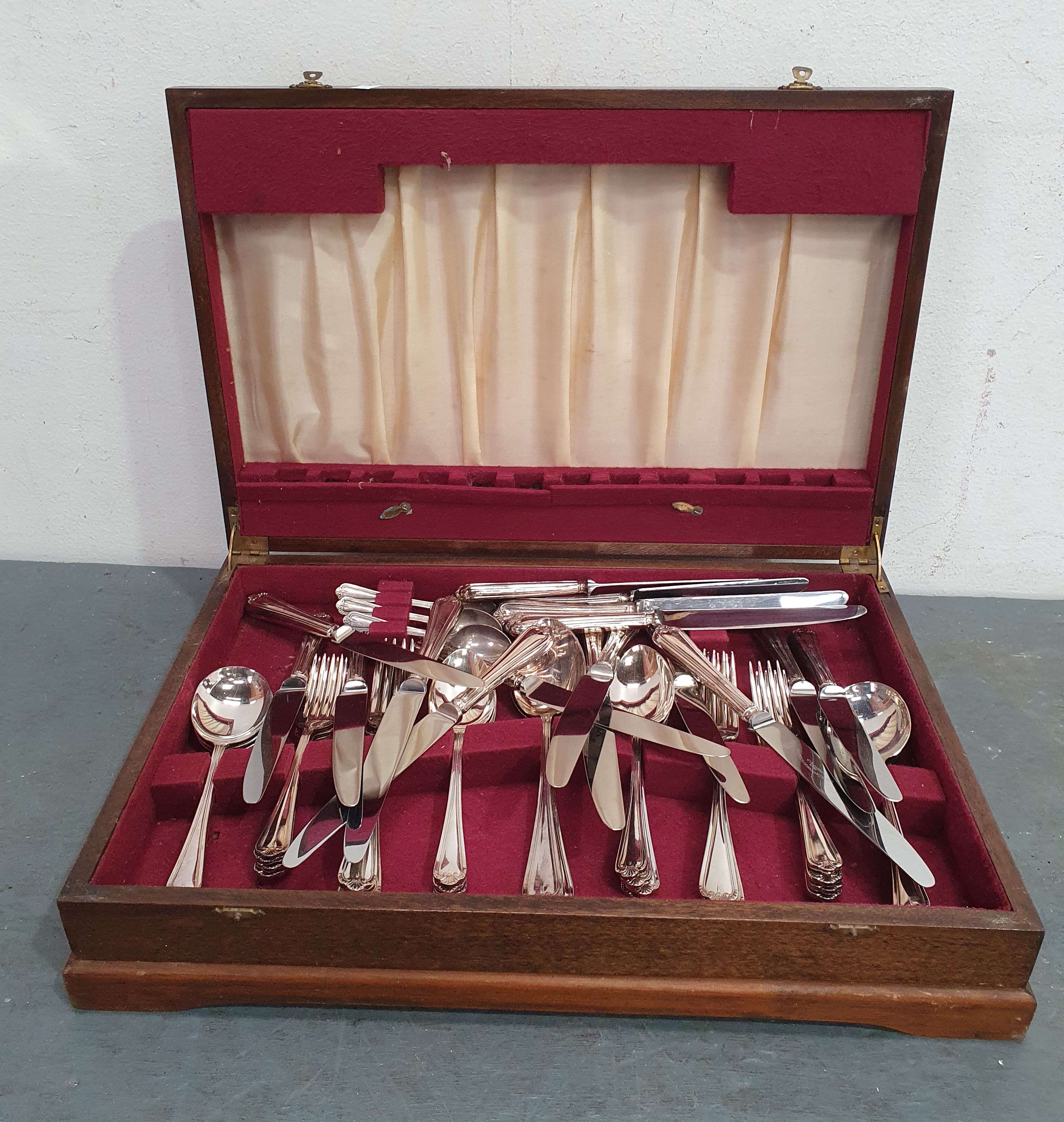 A TIMBER BOX OF CUTLERY