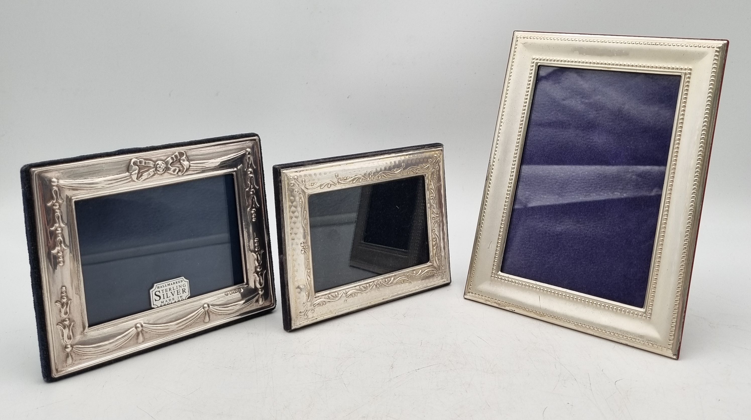 633 · THREE SILVER PHOTO FRAMES