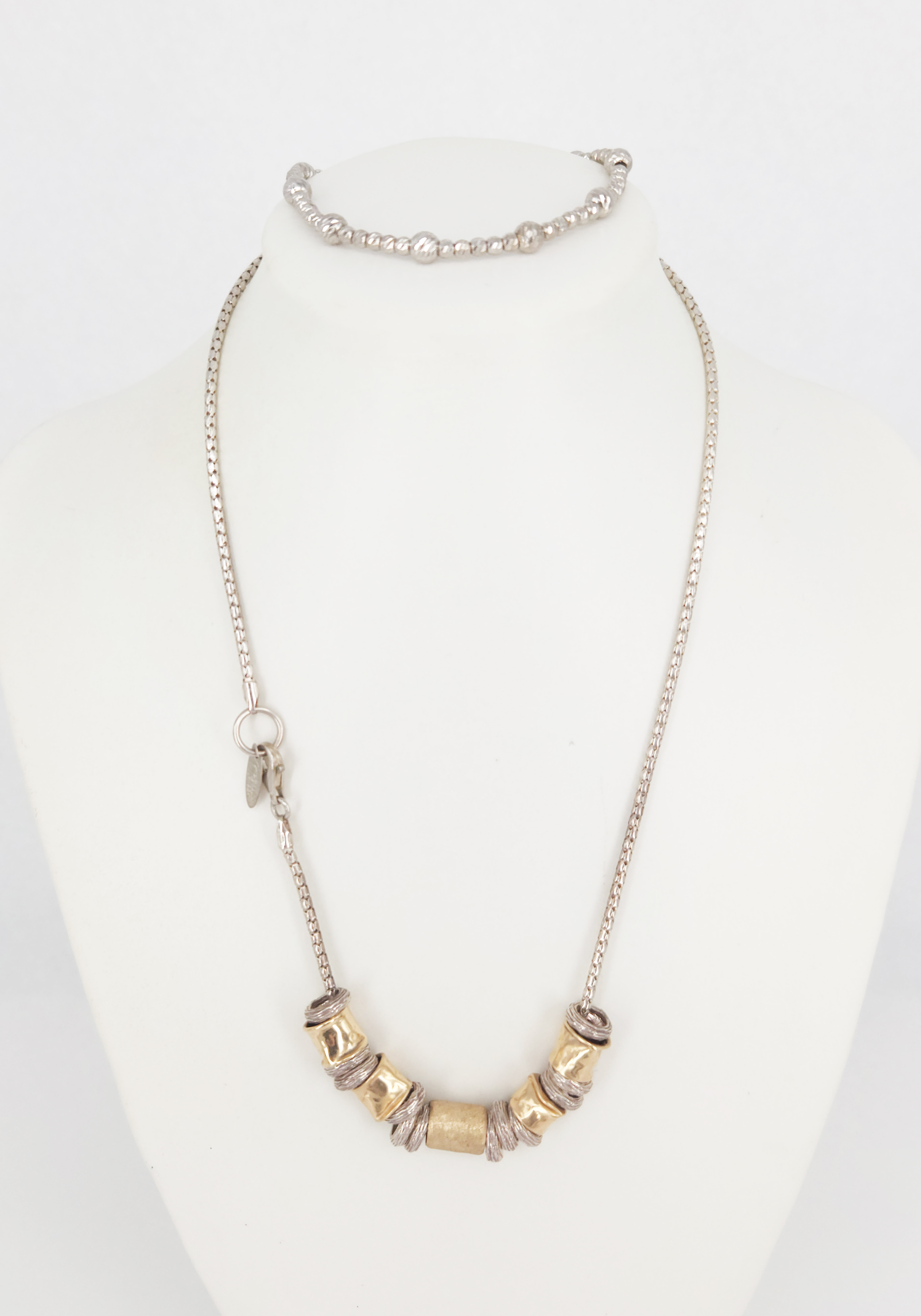 406 · A MAGNOLIA STERLING SILVER NECKLACE AND A BRACELET