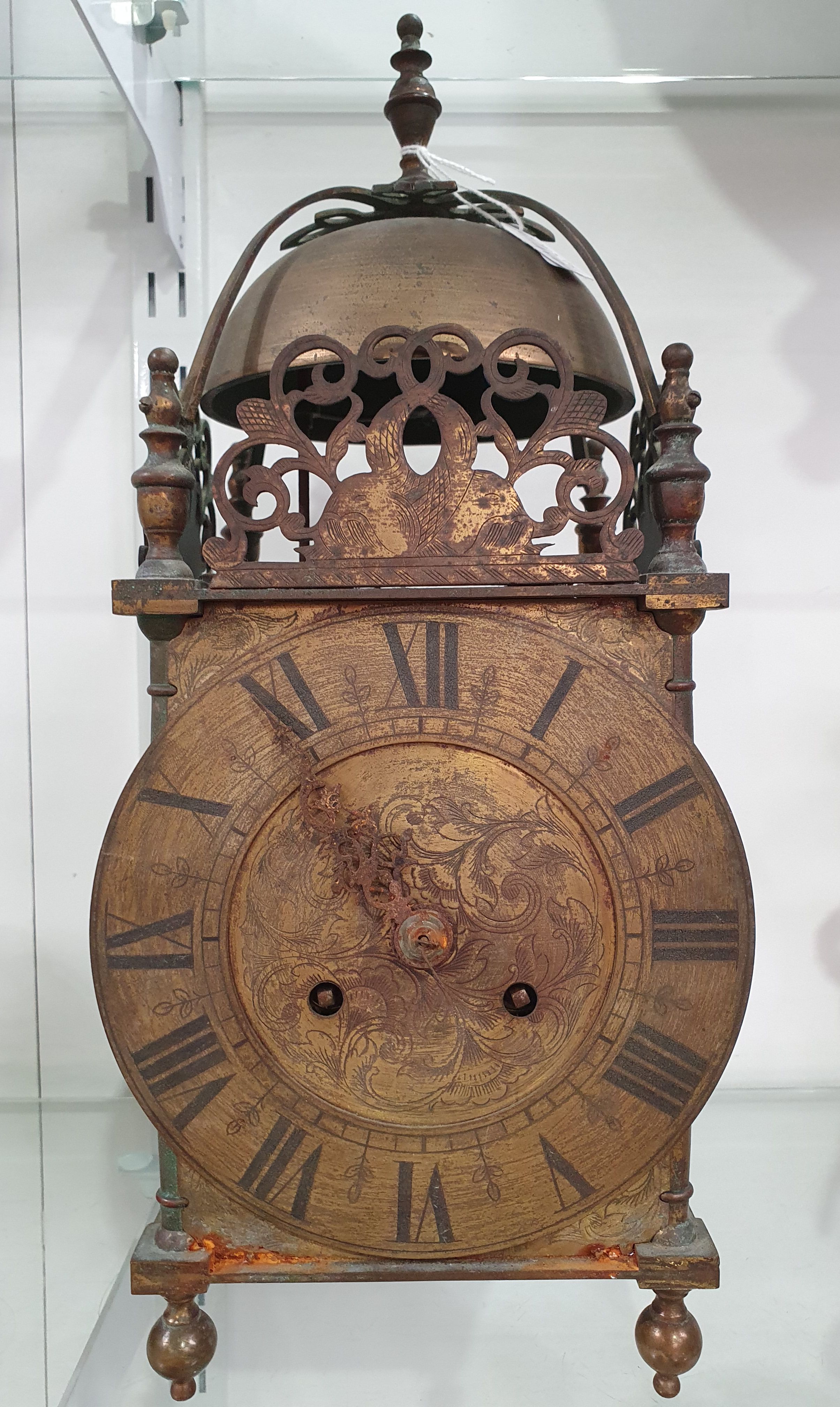 AN EARLY 20TH CENTURY BRASS LANTERN CLOCK