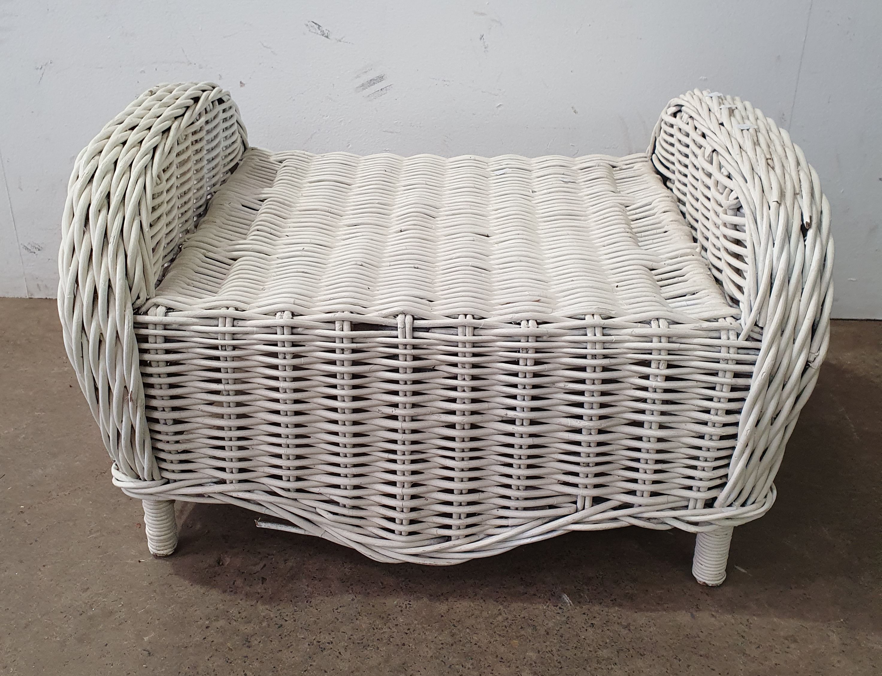 1002 · A WHITE WICKER STOOL