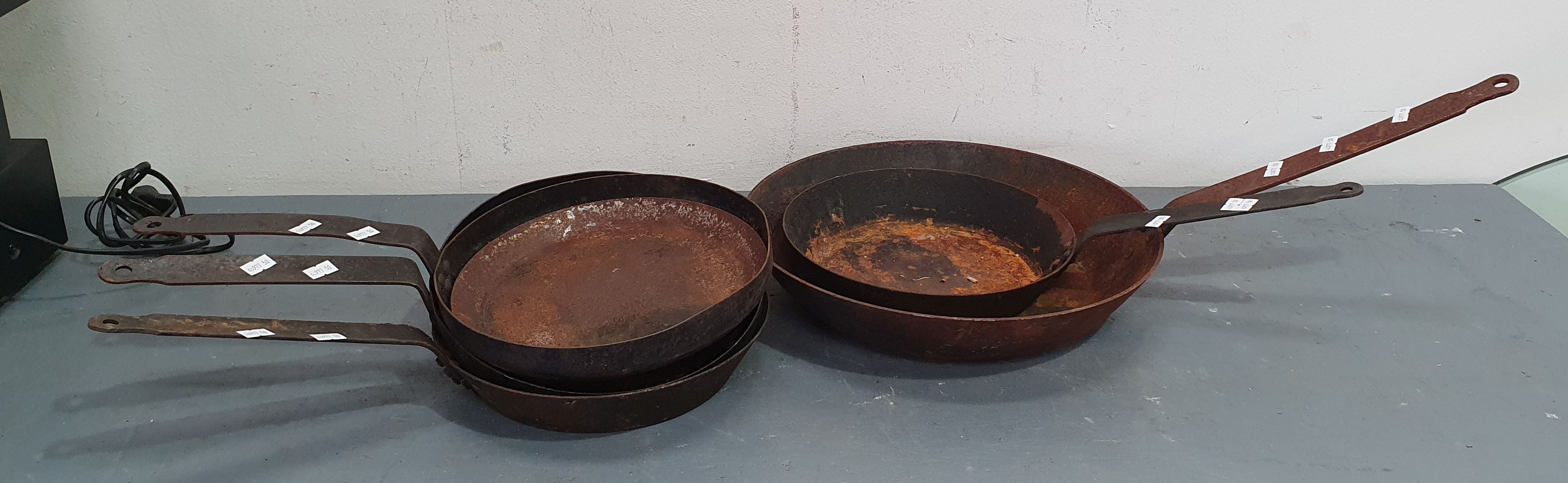 A Group Of Cast Iron Pans