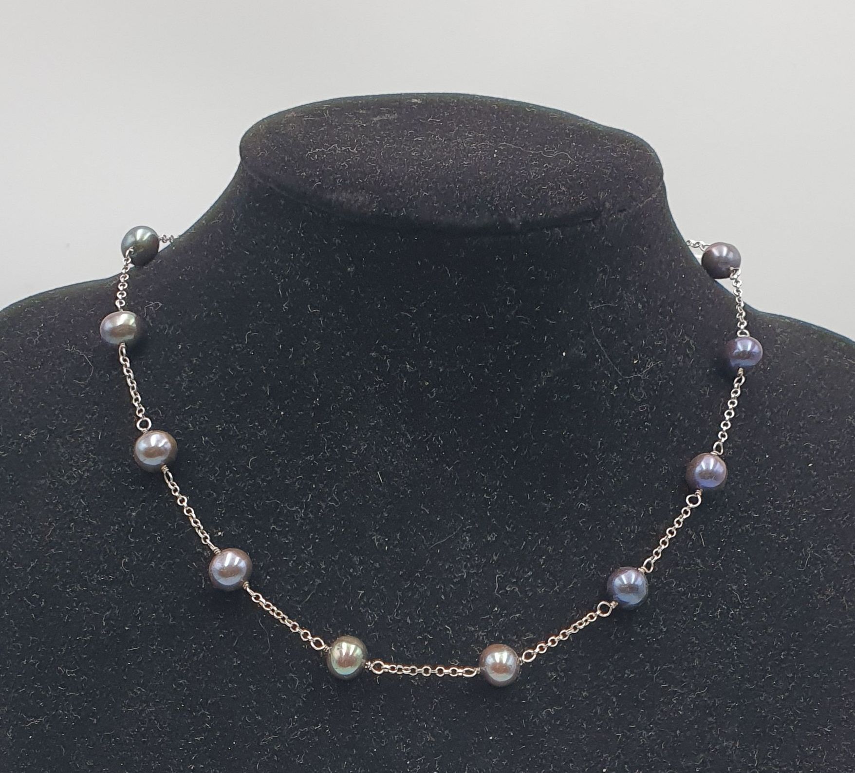 A SILVER AND PEARL NECKLACE