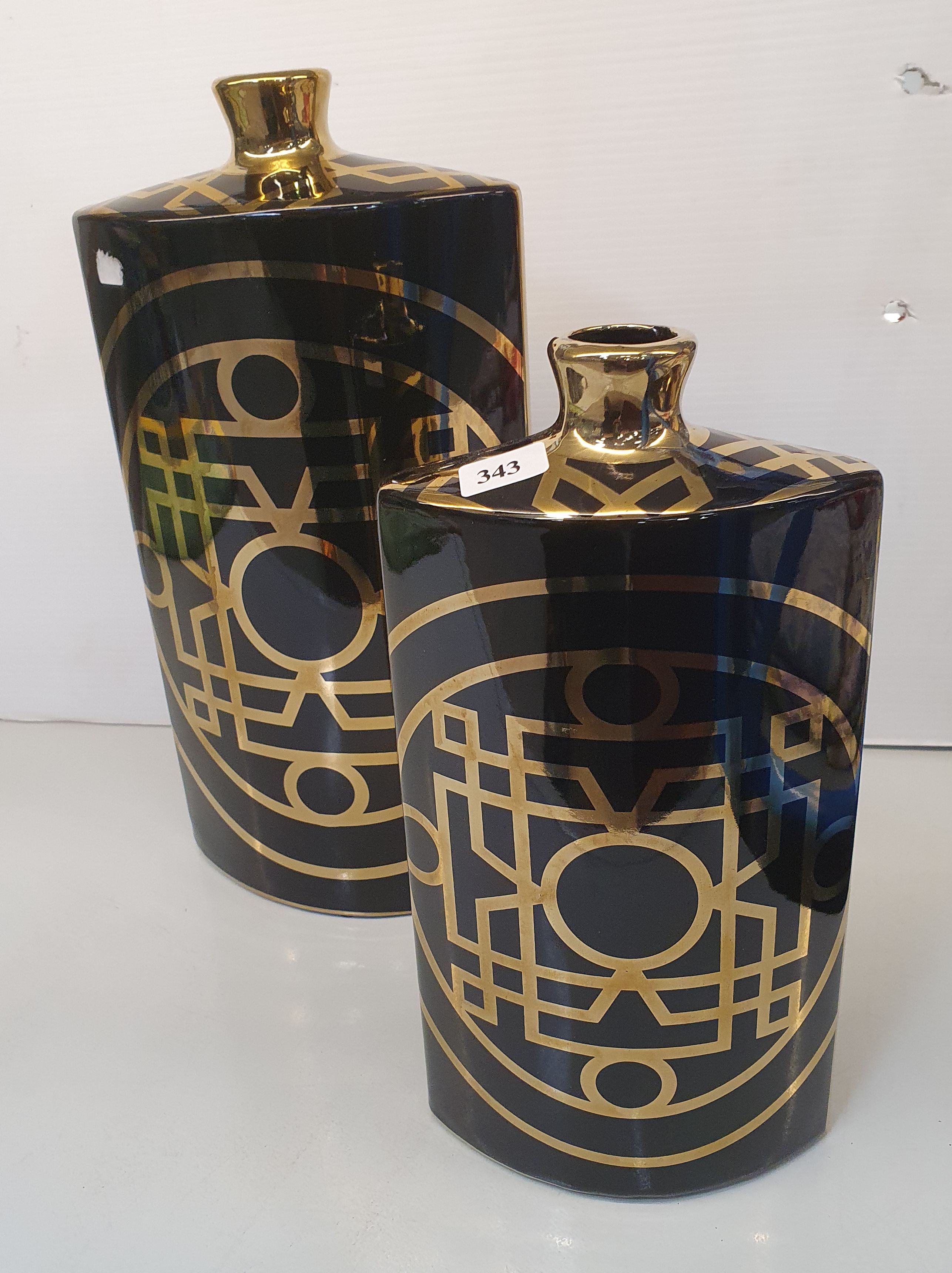 343 · A PAIR OF GRADUATED CERAMIC VASES