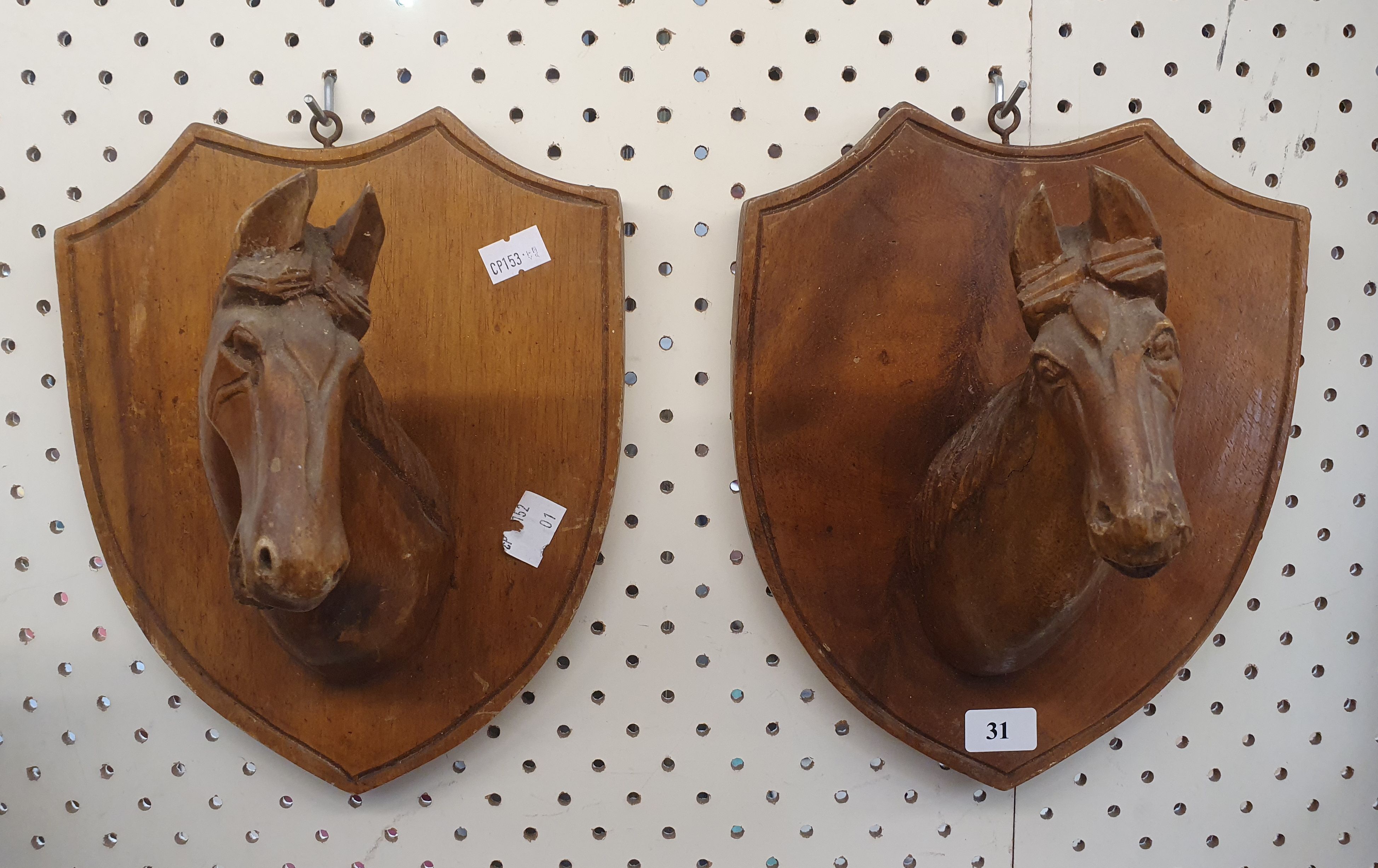 31 · A PAIR OF VINTAGE CARVED WOODEN HORSE HEAD WALL PLAQUES