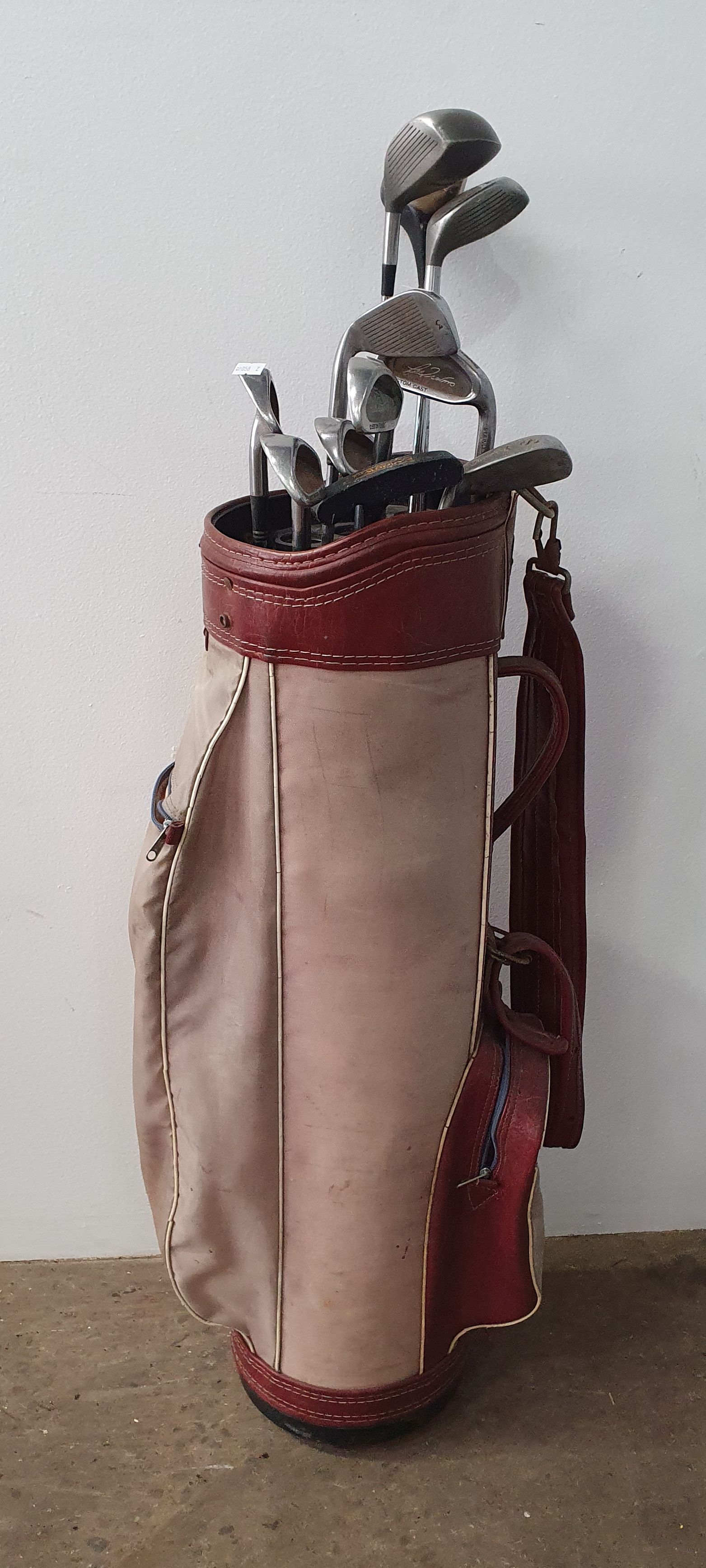 A Group Of Vintage Golf Clubs
