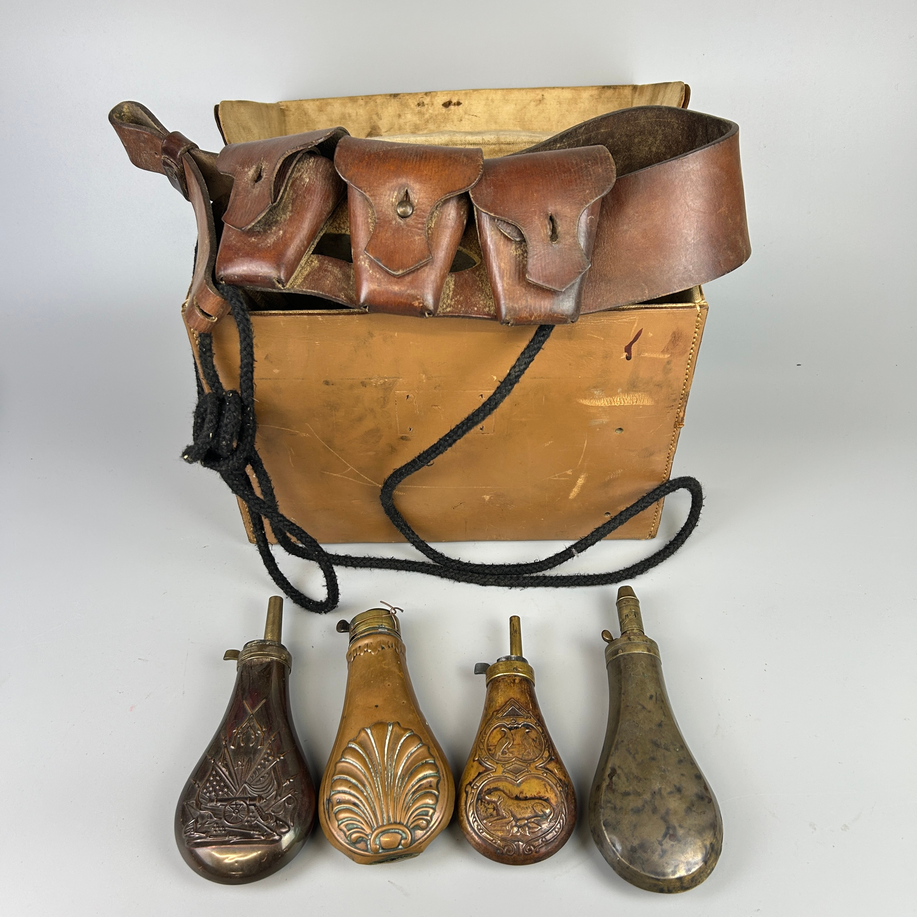 GUN POWDER FLASKS AND BELT. | Chalkwell Auctions