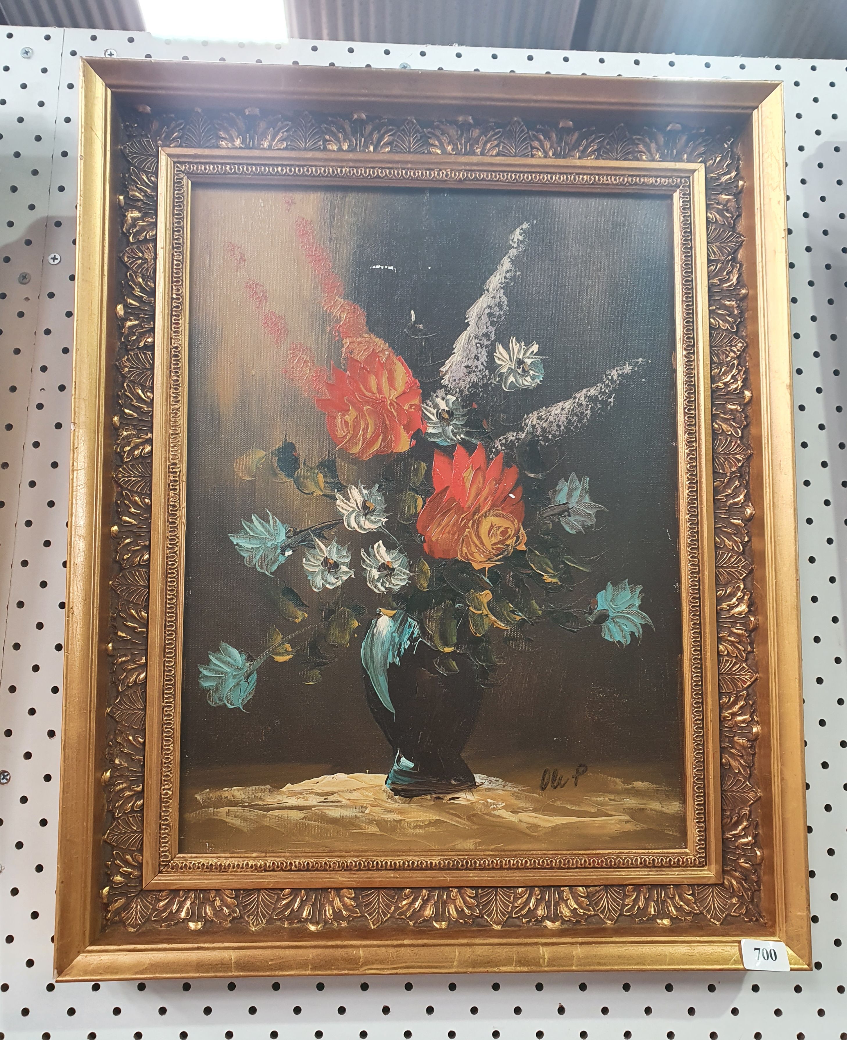 734 · A FLORAL STILL LIFE IN A DECORATIVE GILDED FRAME