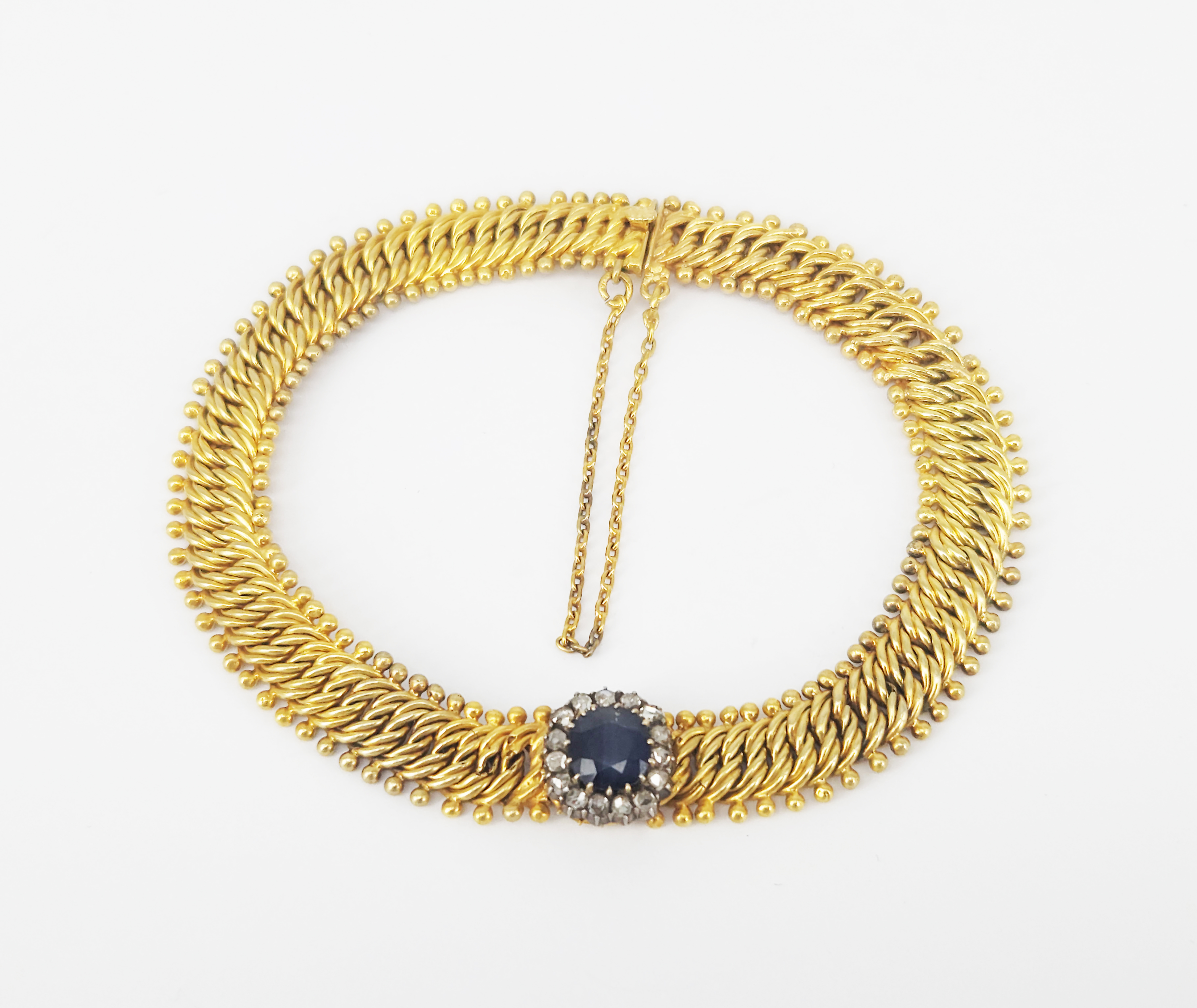 A Yellow Gold Sapphire And Diamond Cluster Bracelet