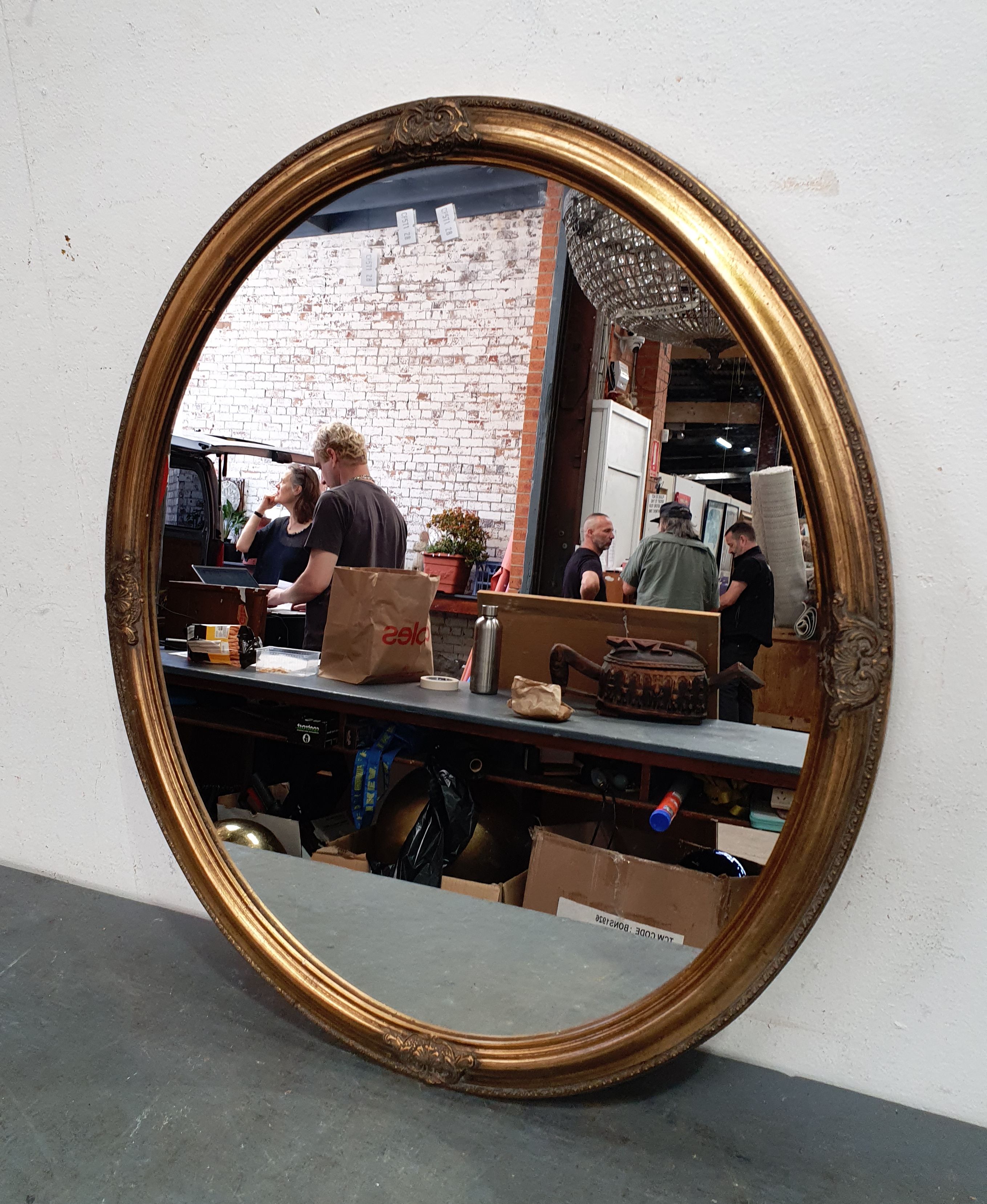 A Gilt Frame Oval Mirror