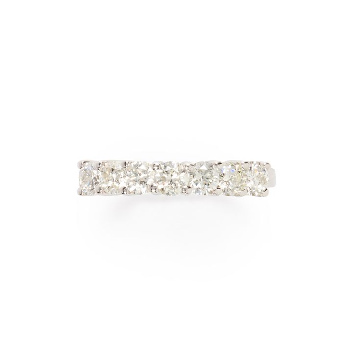 A diamond and fourteen karat white gold ring