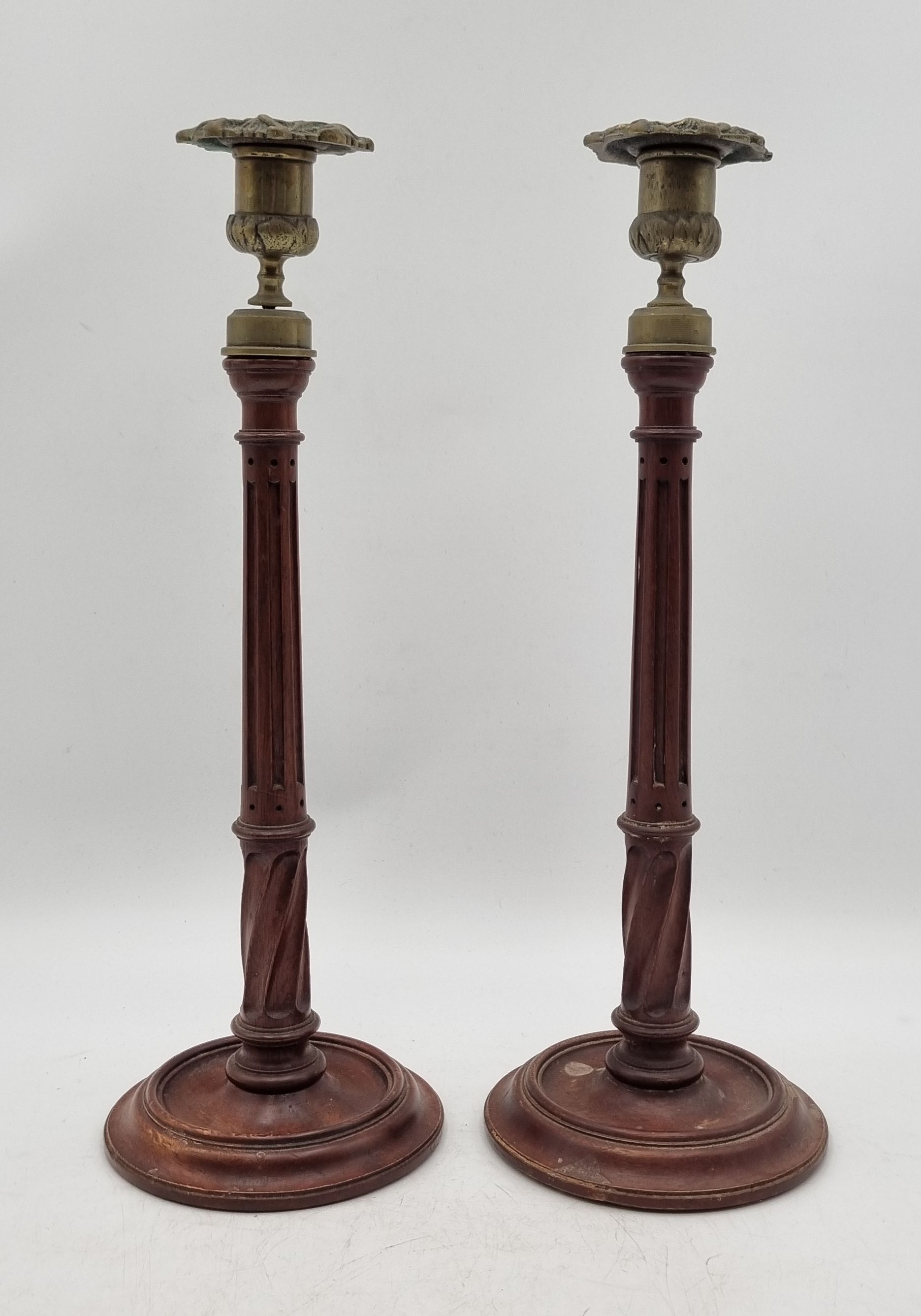A PAIR OF CONTINENTAL TURNED WOODEN CANDLESTICKS