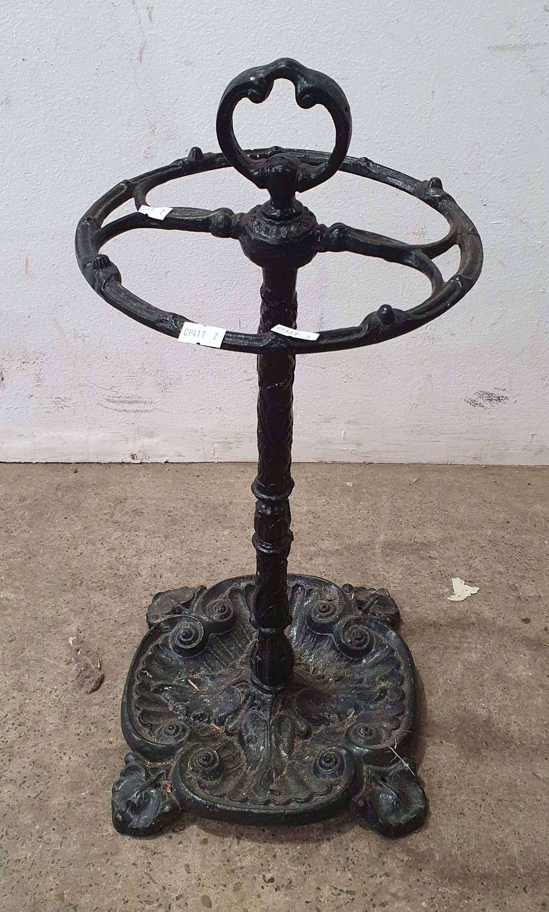 1153 · A CAST IRON UMBRELLA STAND