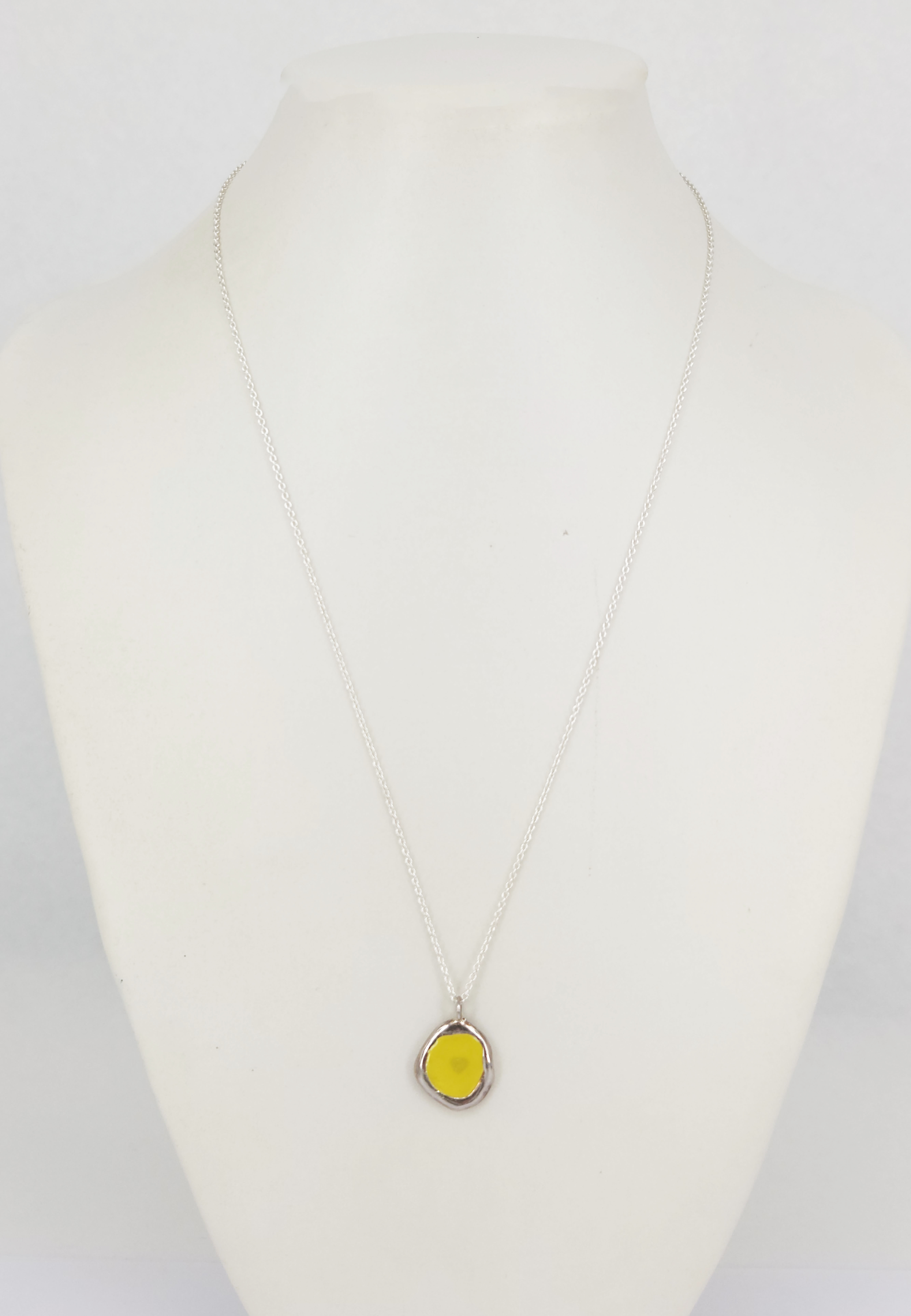438 · A STERLING SILVER YELLOW ENAMEL 'DROP OF YELLOW' PENDANT