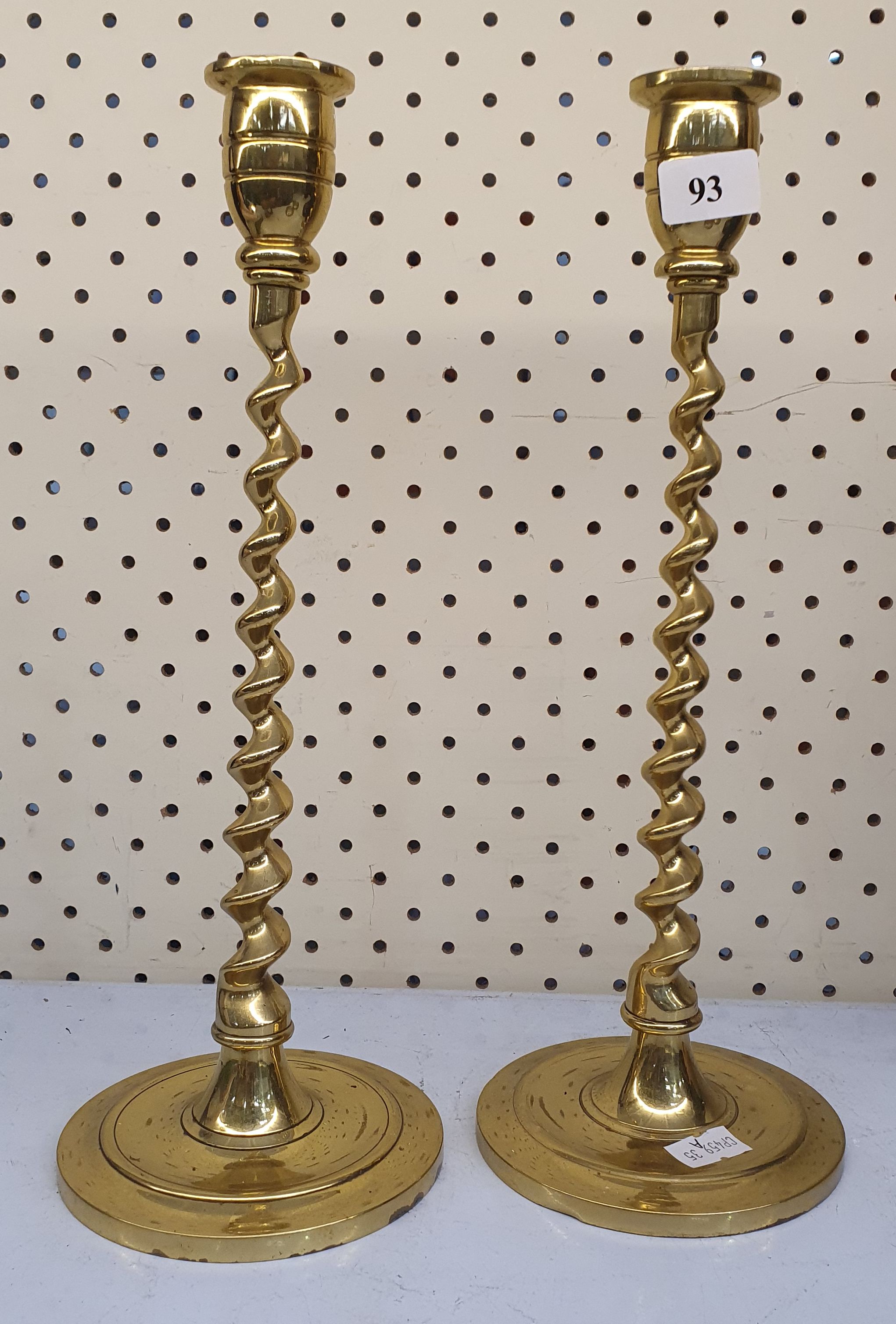 93 · A PAIR OF BRASS TWISTED STEM CANDLESTICK