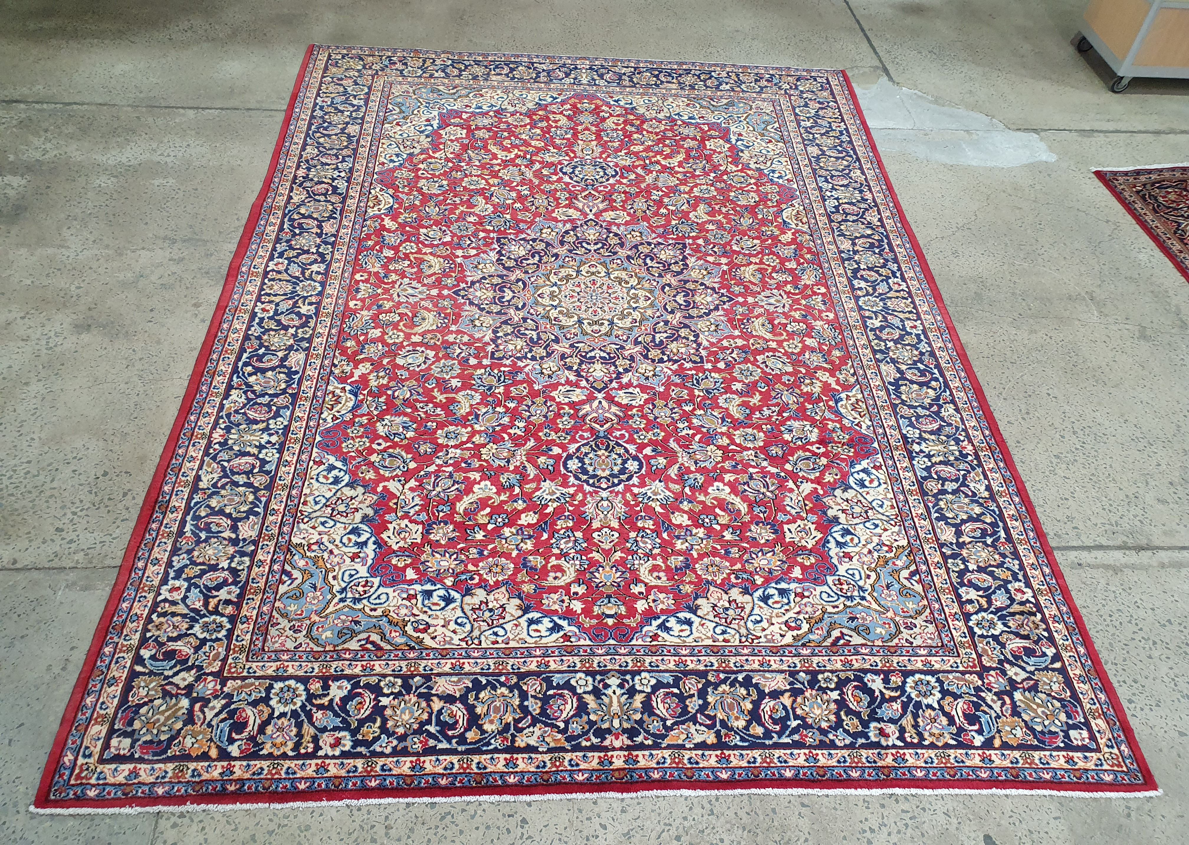 A LARGE PERSIAN HAMADAN CARPET
