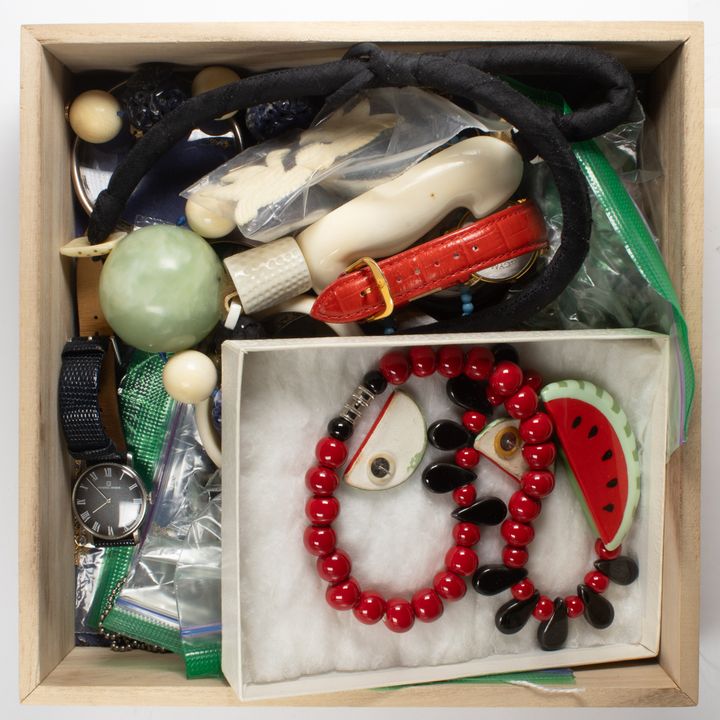 A box of miscellaneous jewelry items