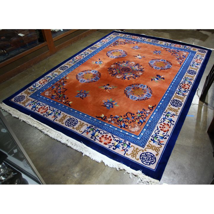 Chinese orange and blue rug with flowers and shou medallions