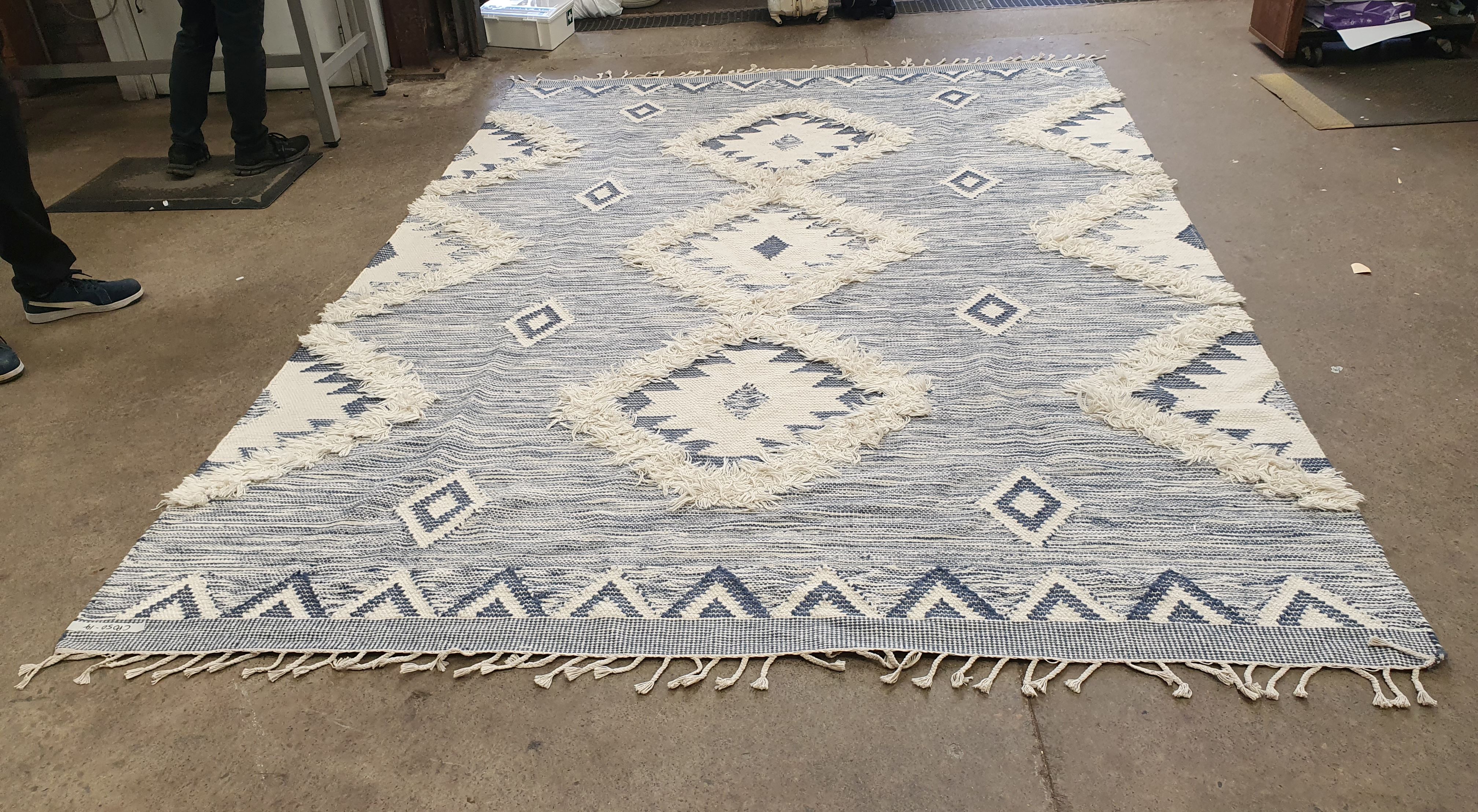 A Blue And White Hand Knotted Rug