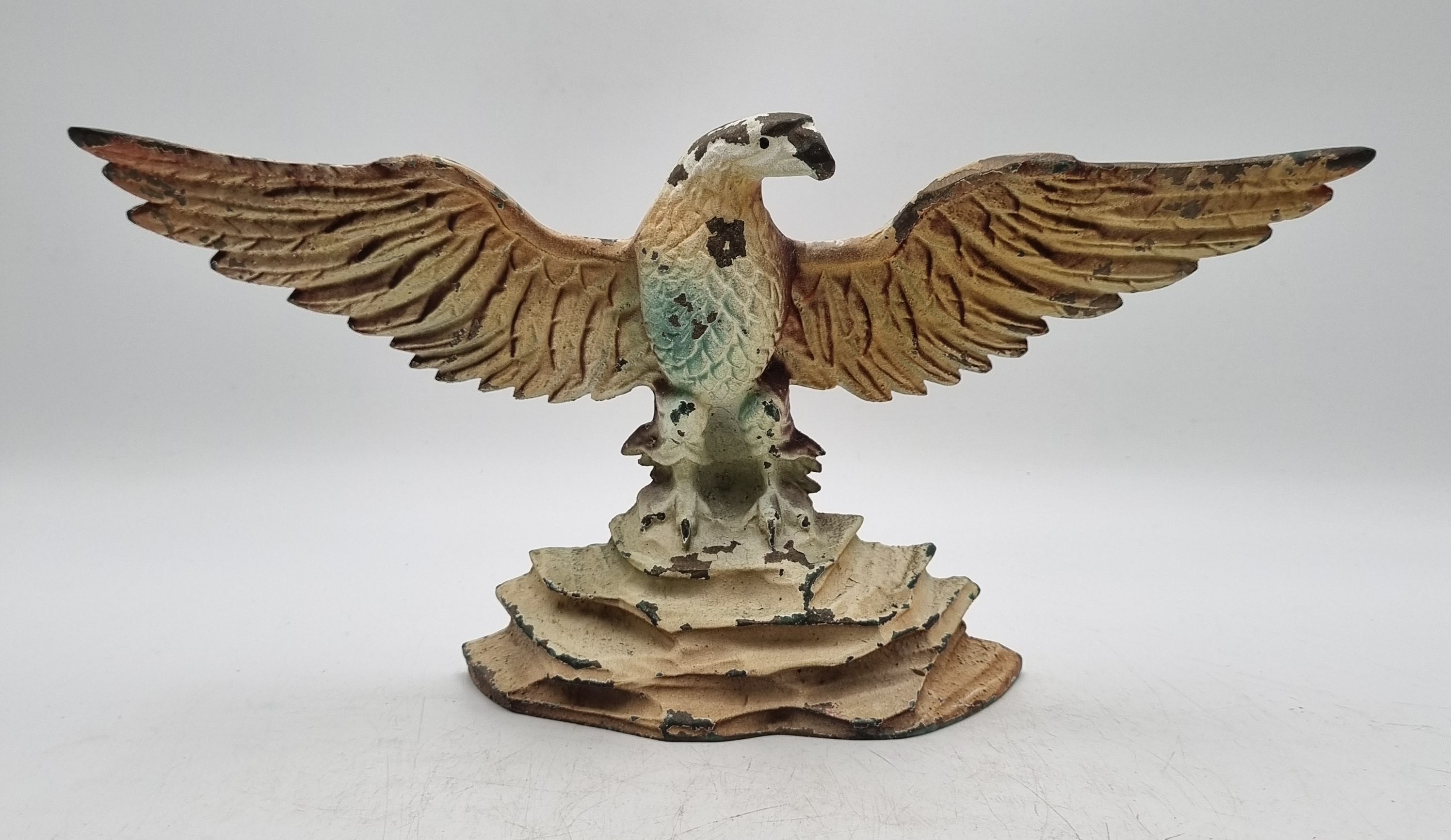 649 · A PAINTED CAST METAL EAGLE DOORSTOP