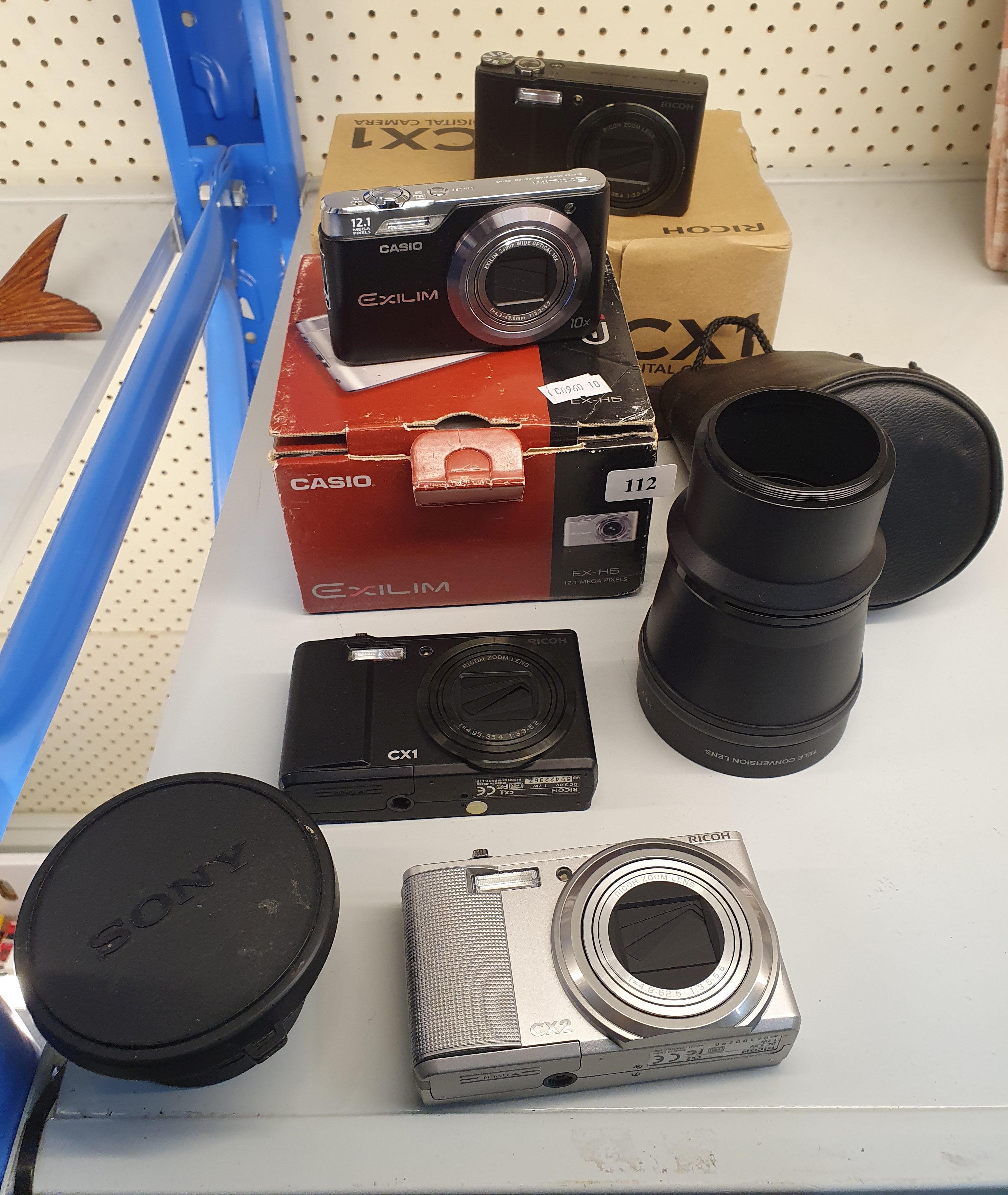 112 · THREE RICOH CAMERAS AND A CASIO CAMERA