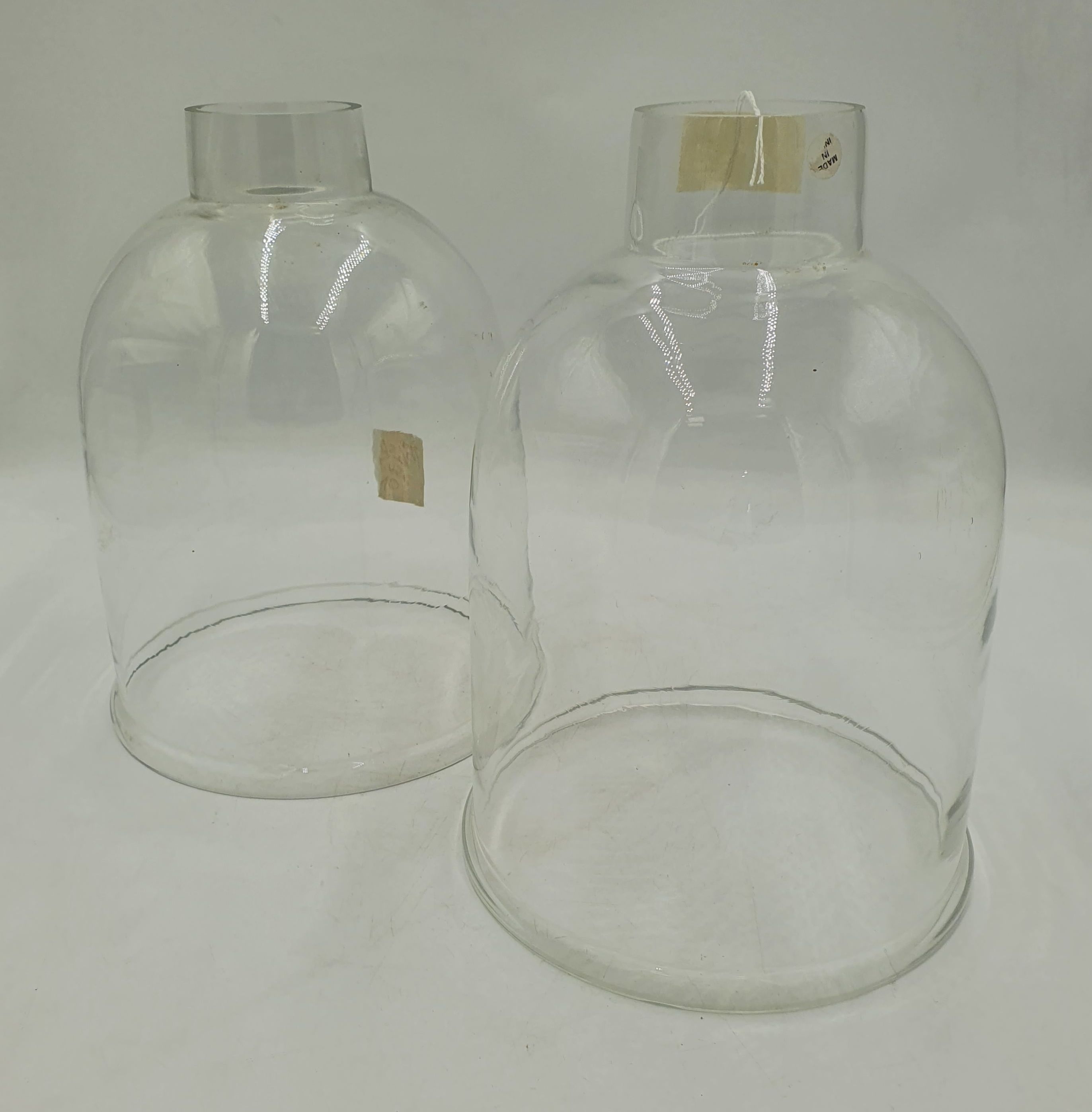 A Pair Of Two Glass Cloche Domes