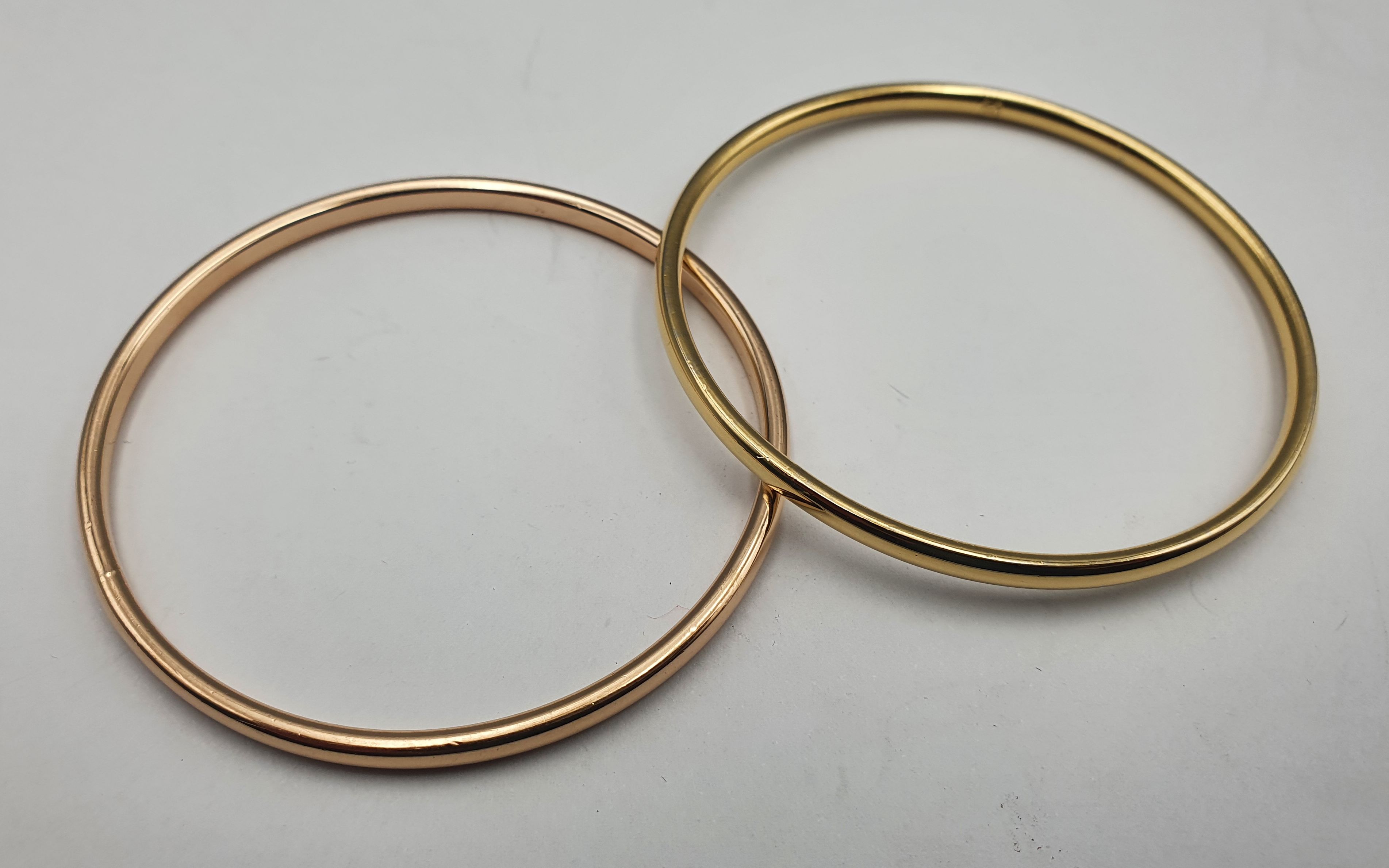 269 · TWO GOLD PLATED BANGLES