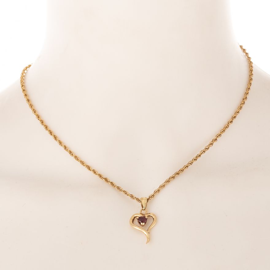 An Open Heart Pendant with Ruby in 14K