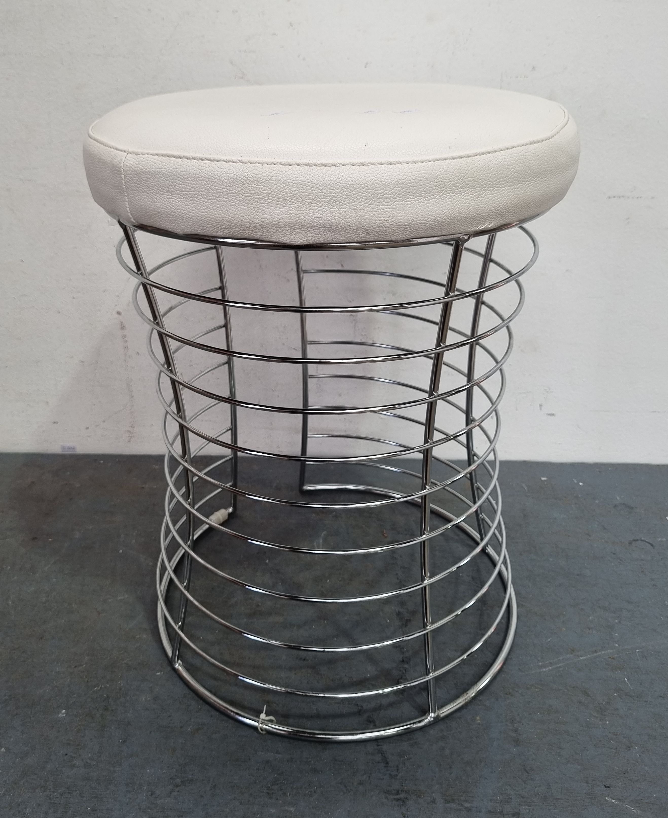 A Single Chrome And Vinyl Stool