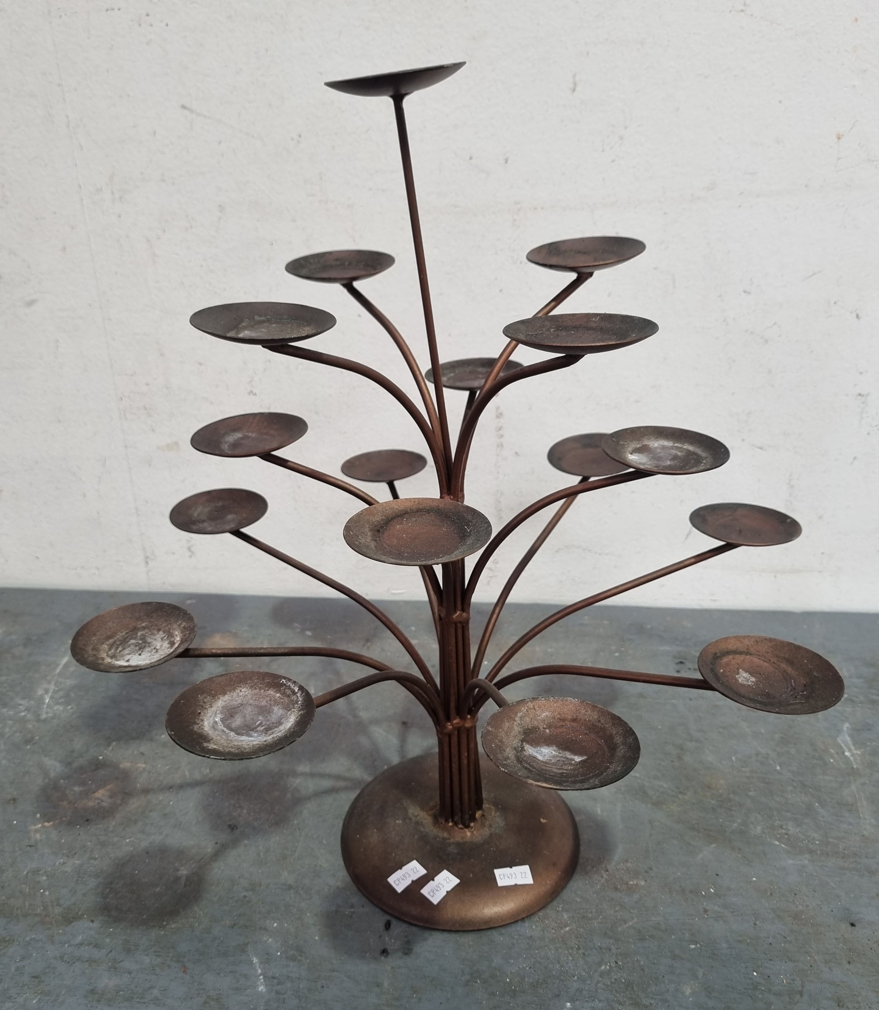 A METAL CANDLE HOLDER