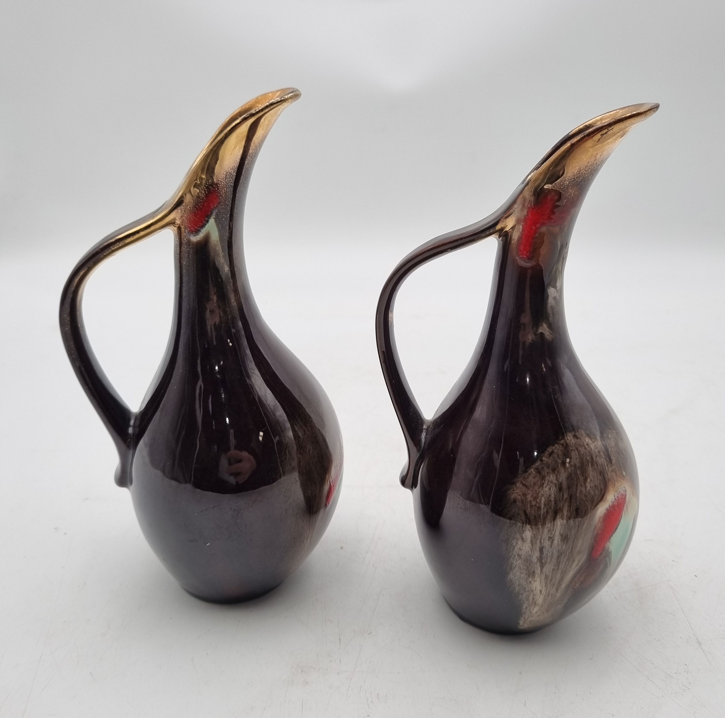 158 · A PAIR OF VINTAGE GERMAN DRIP GLAZED EWERS