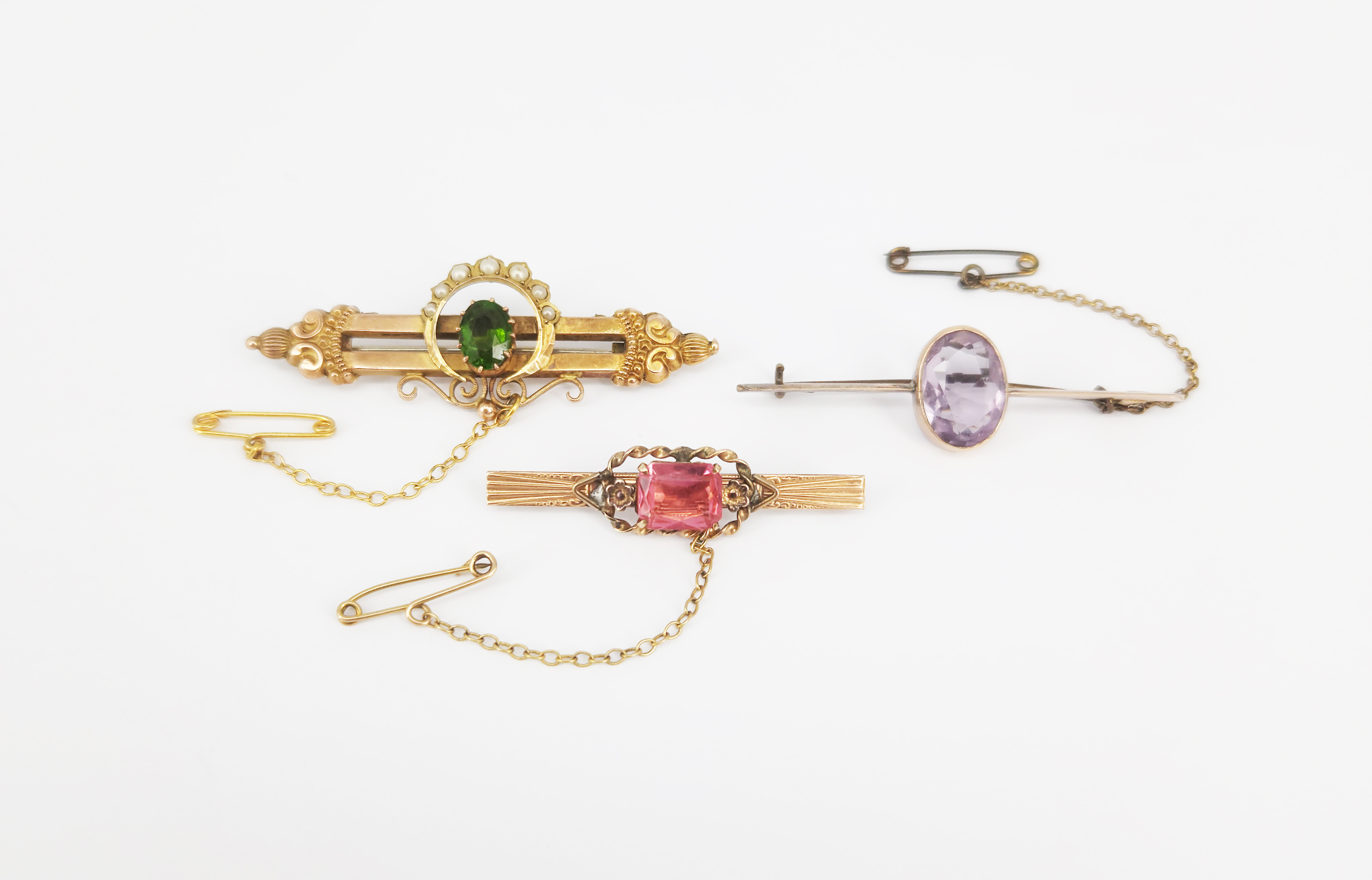 124 · THREE BAR BROOCHES