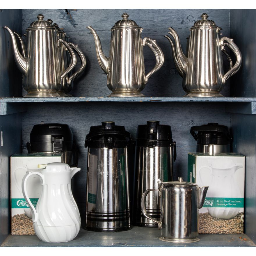 Two shelves of catering accessories
