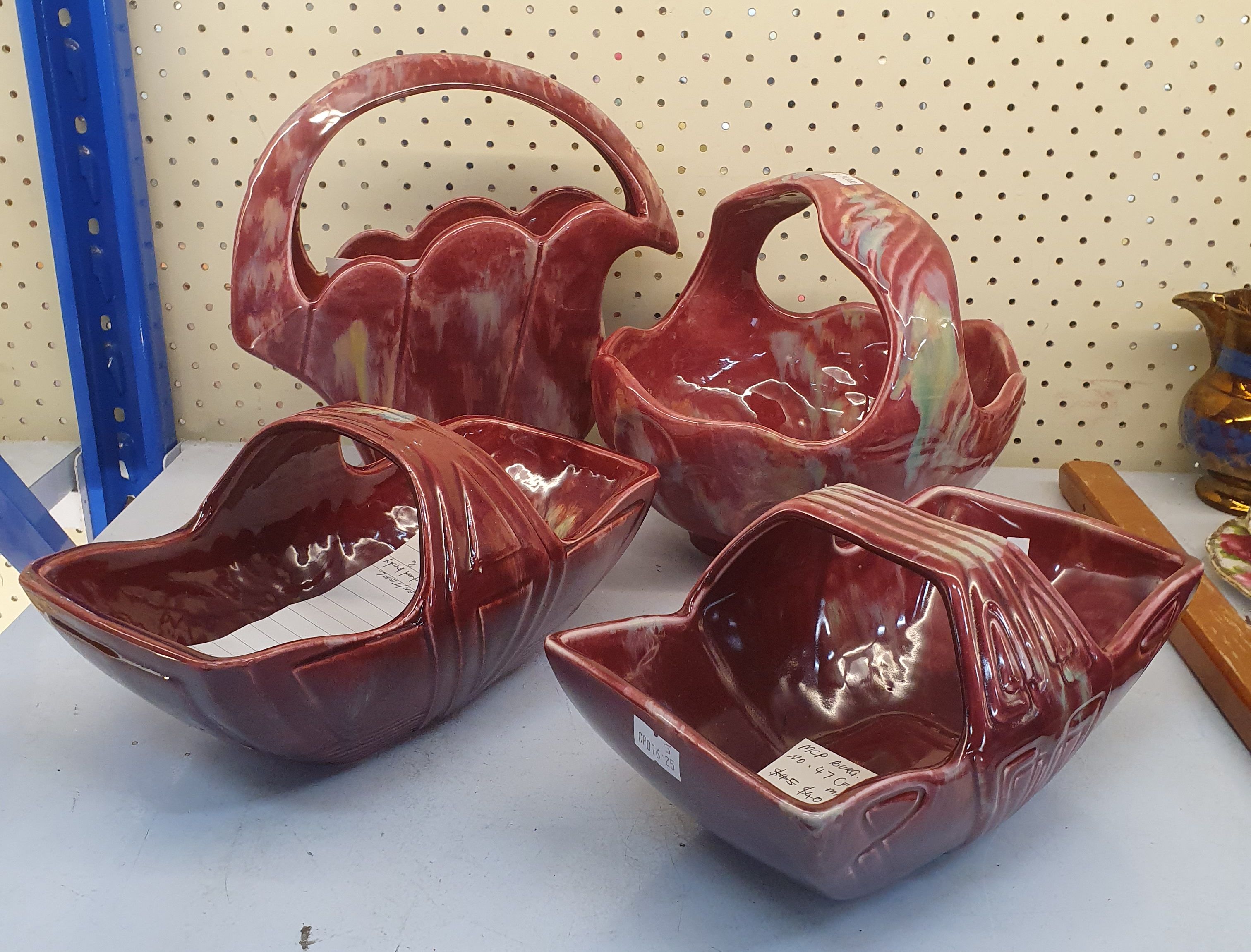 47 · A GROUP OF VARIOUS MCP MINGAY BASKETS IN THE BURGUNDY DRIP GLAZE COLOURWAY
