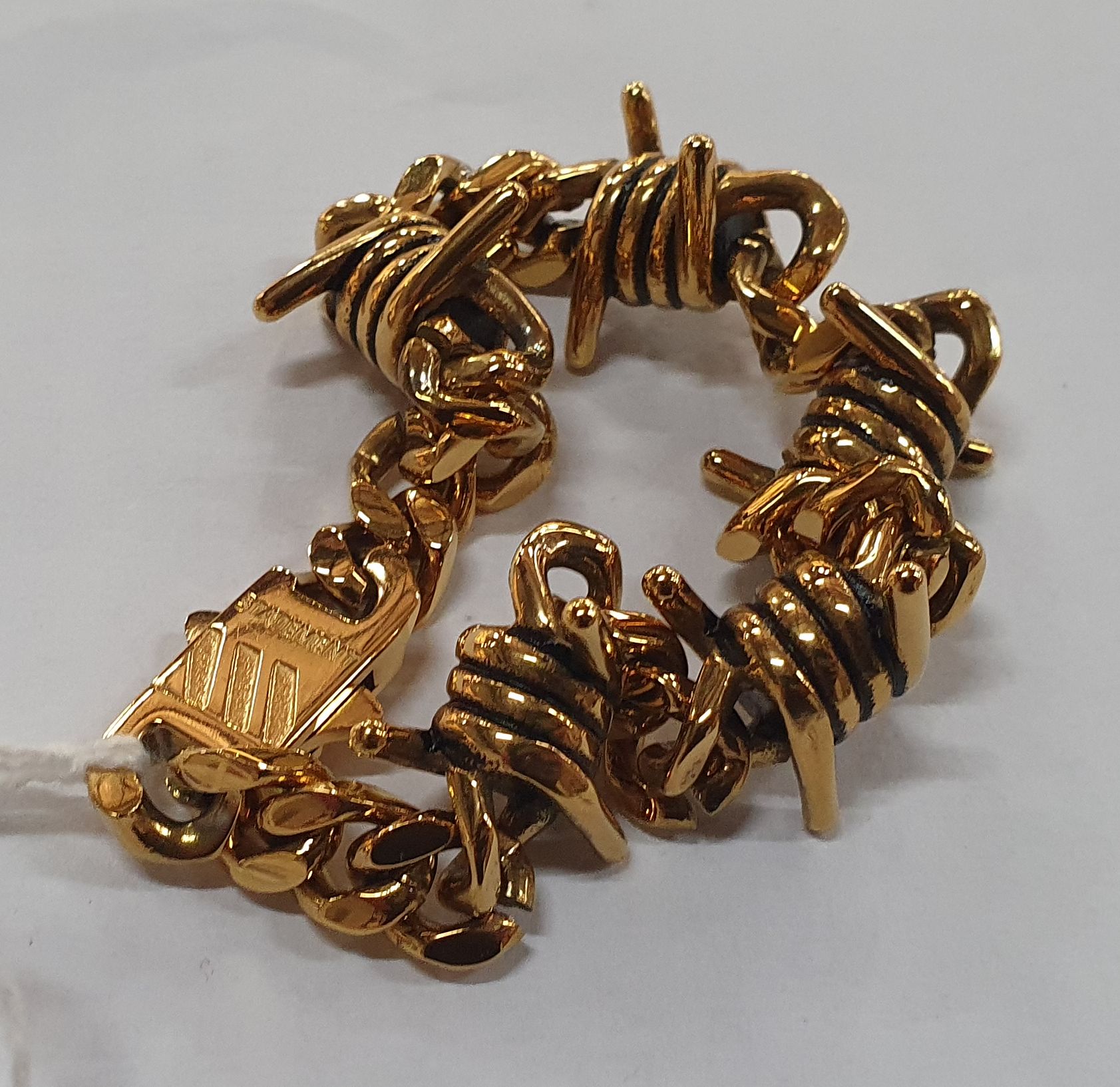 205 · A STATEMENT 22ct GOLD PLATED BRACELET