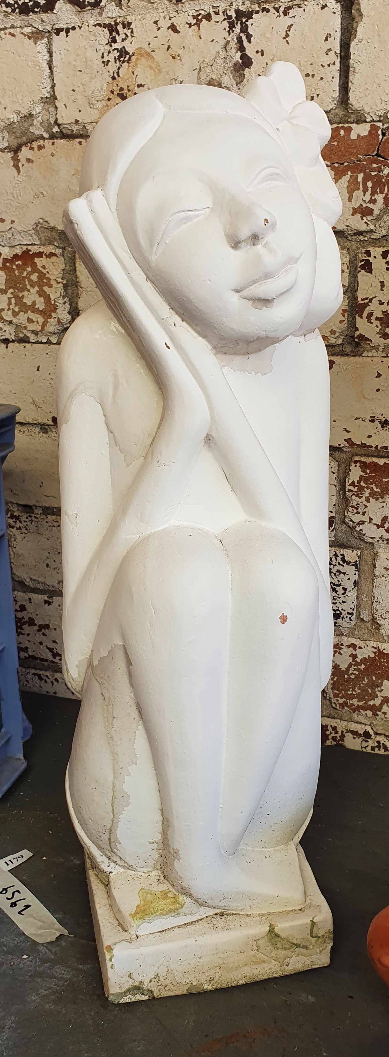 1135 · A PLASTER STATUE