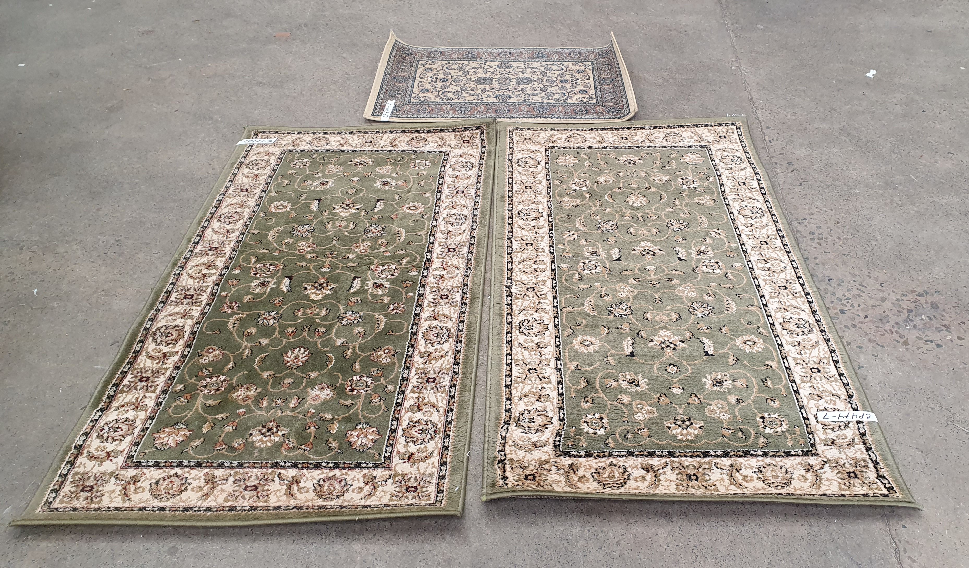 A Trio Of Small Rugs