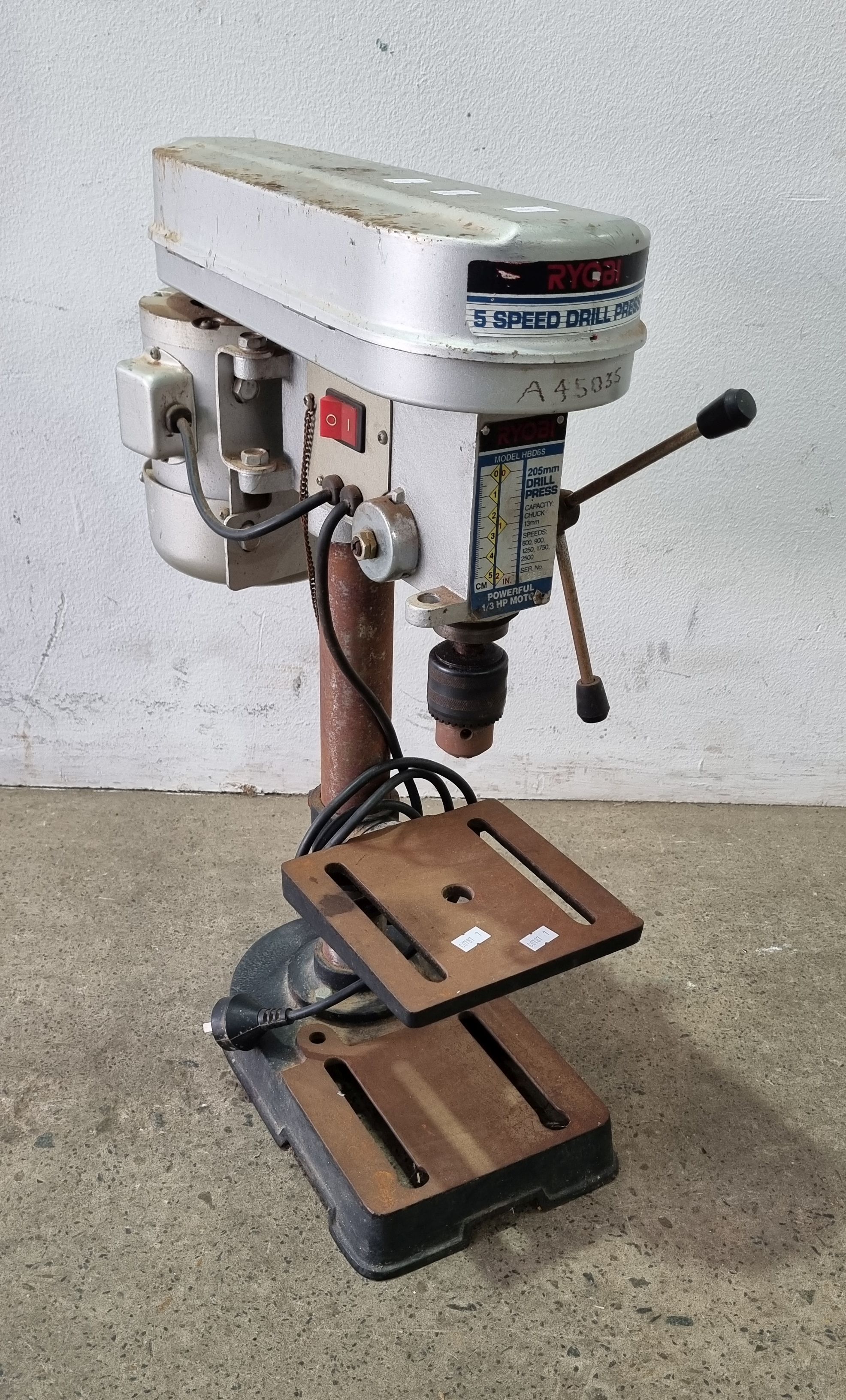 A Ryobi Five Speed Drill Press