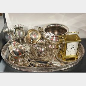A quantity of silverplate and a carriage clock.