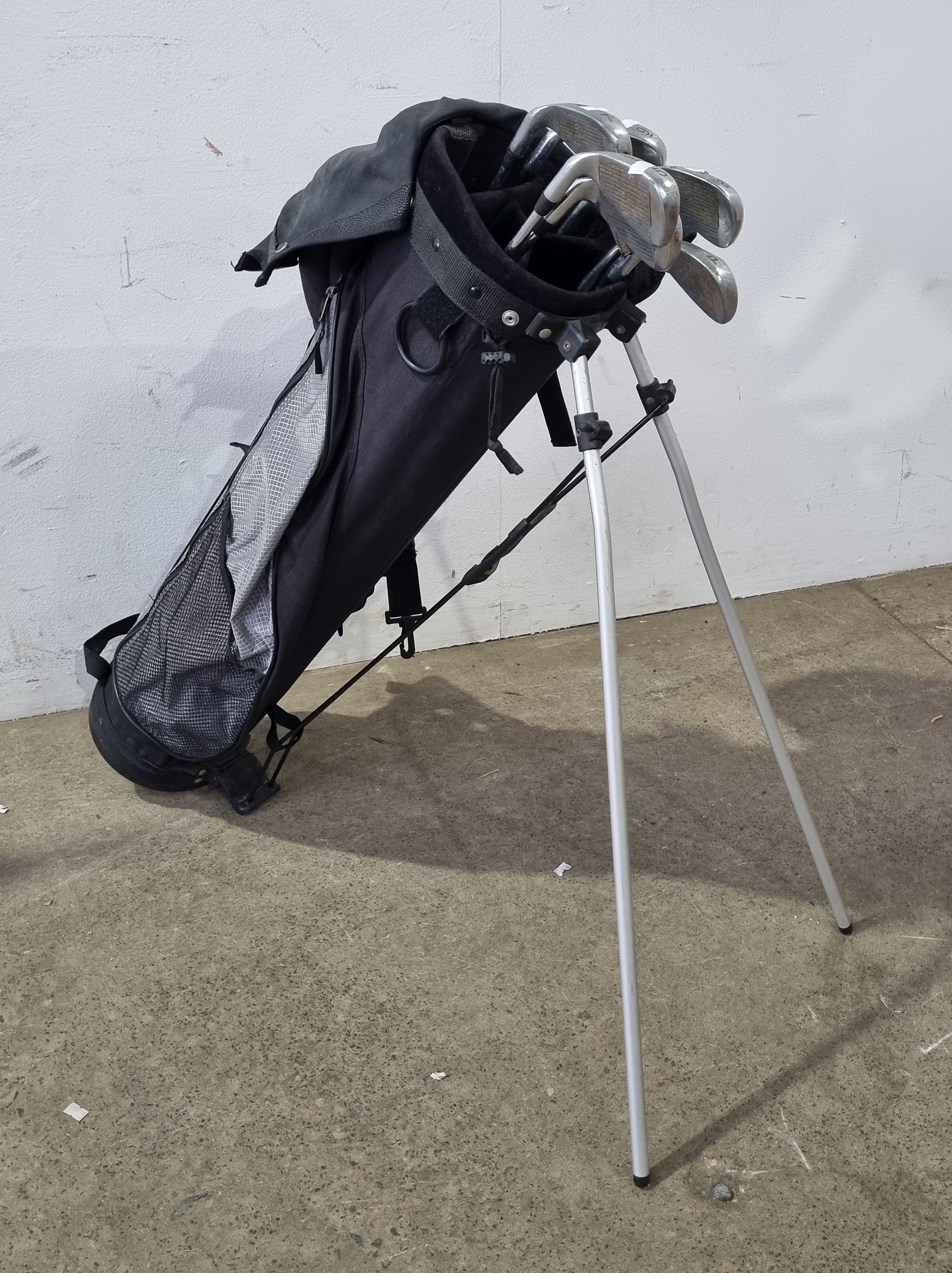 A Group Of Wilson Golf Clubs