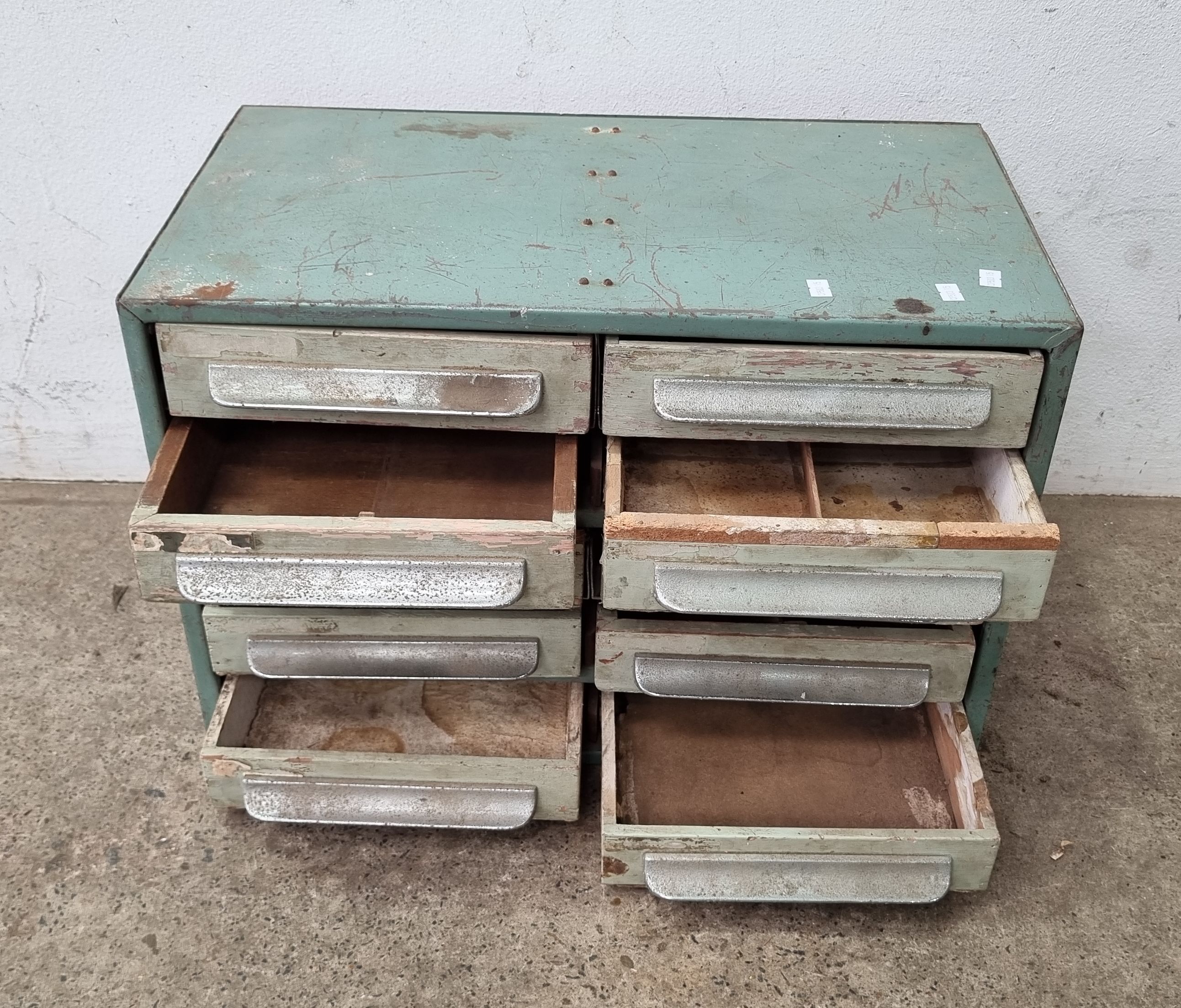 AN INDUSTRIAL CHEST OF DRAWERS