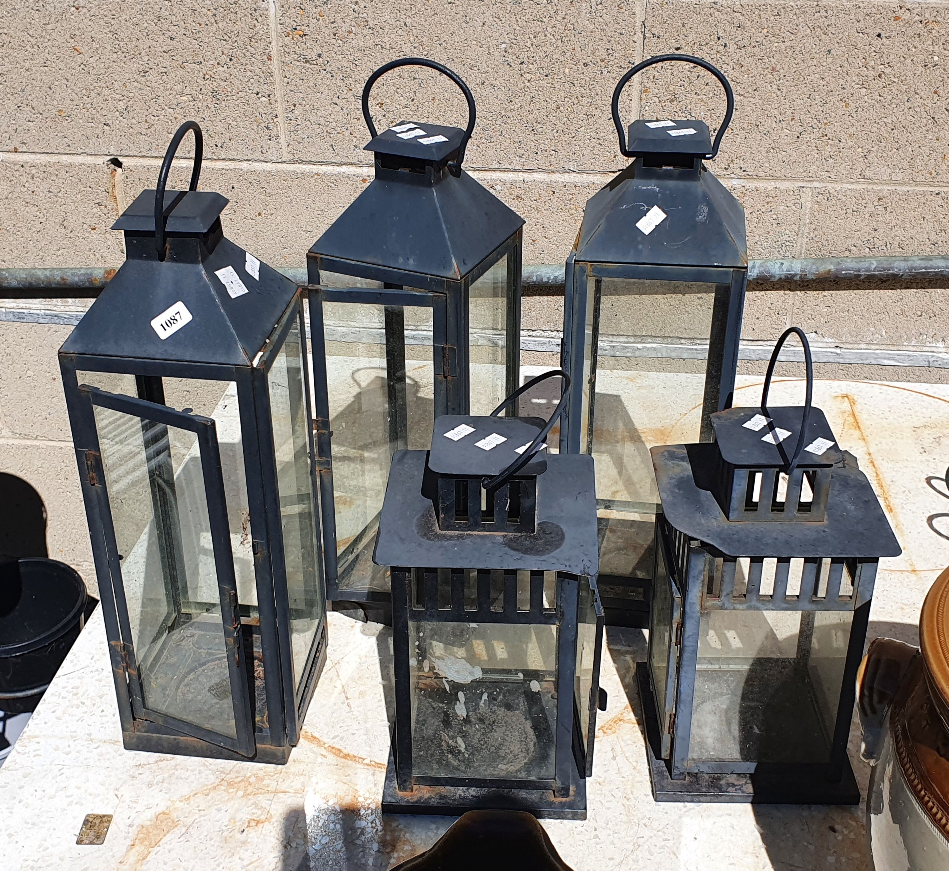 1087 · FIVE VARIOUS CANDLE HANDLES