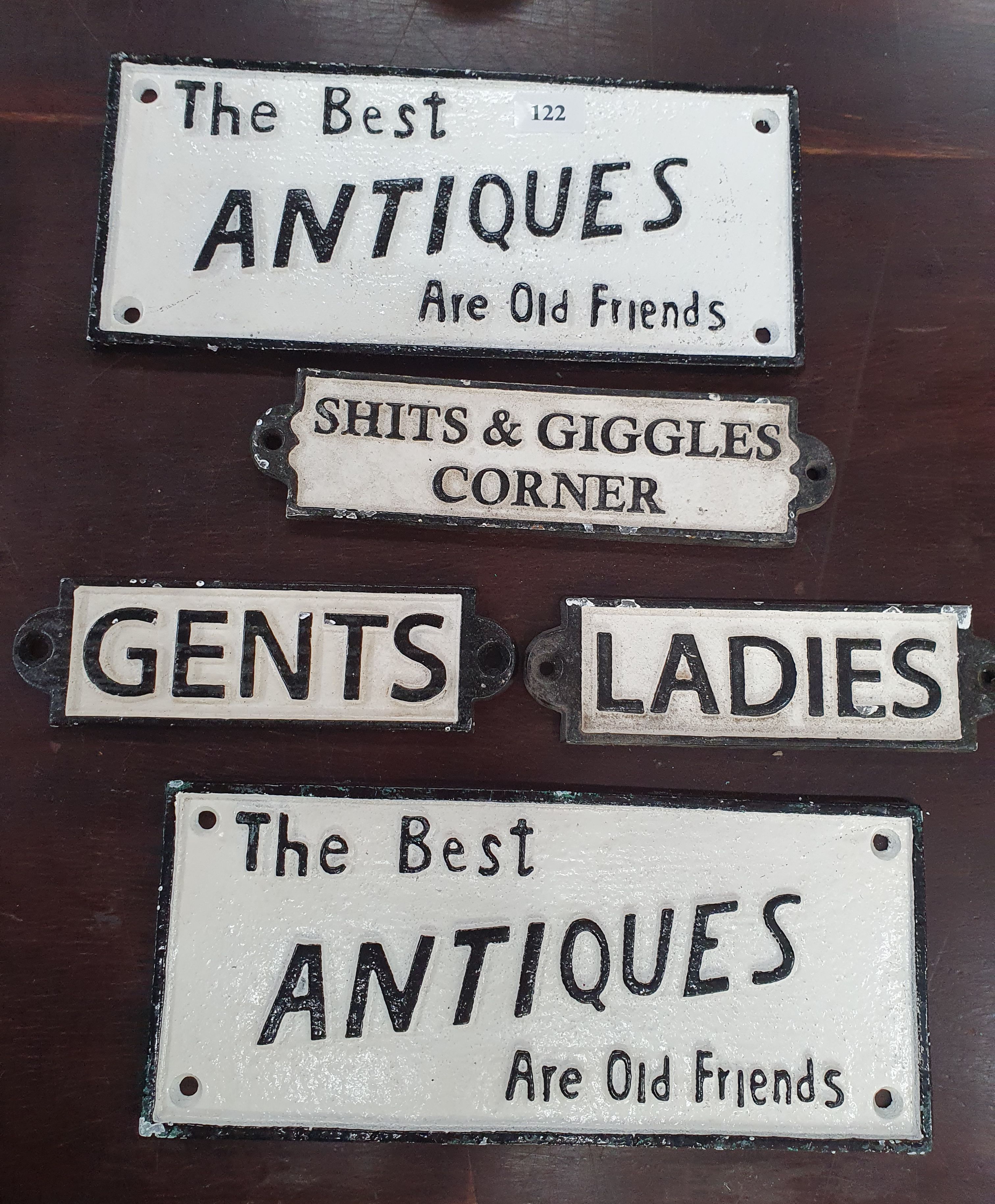 122 · FIVE VARIOUS REPRODUCTION CAST IRON SIGNS