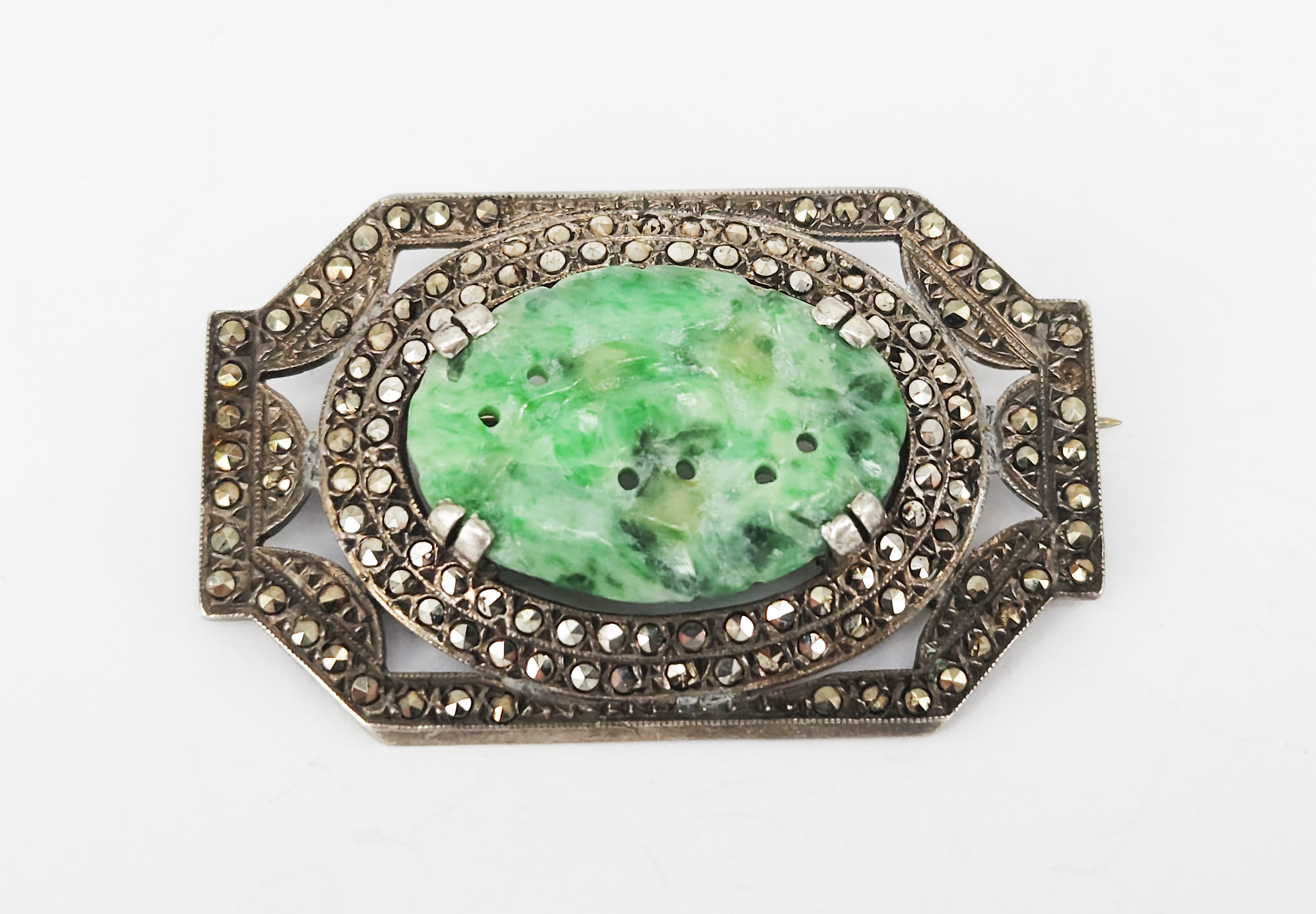 360 · A VINTAGE SILVER CARVED JADE AND MARCASITE BROOCH
